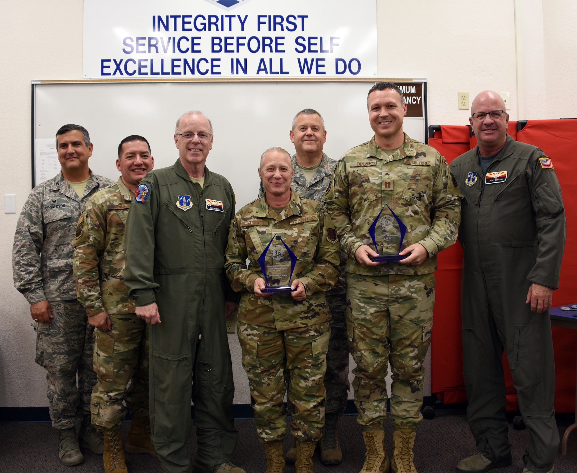 Lt. Col. Tiffiny Strever, 161st MDG Chief Nurse and Capt. James Taylor, 161st MDG medical readiness officer were presented awards from the Air National Guard Medical Service Annual Awards program at Goldwater Air National Guard Base, Phoenix, Nov. 2, 2019. (U.S. Air National Guard photo by Tech. Sgt. Michael Matkin)