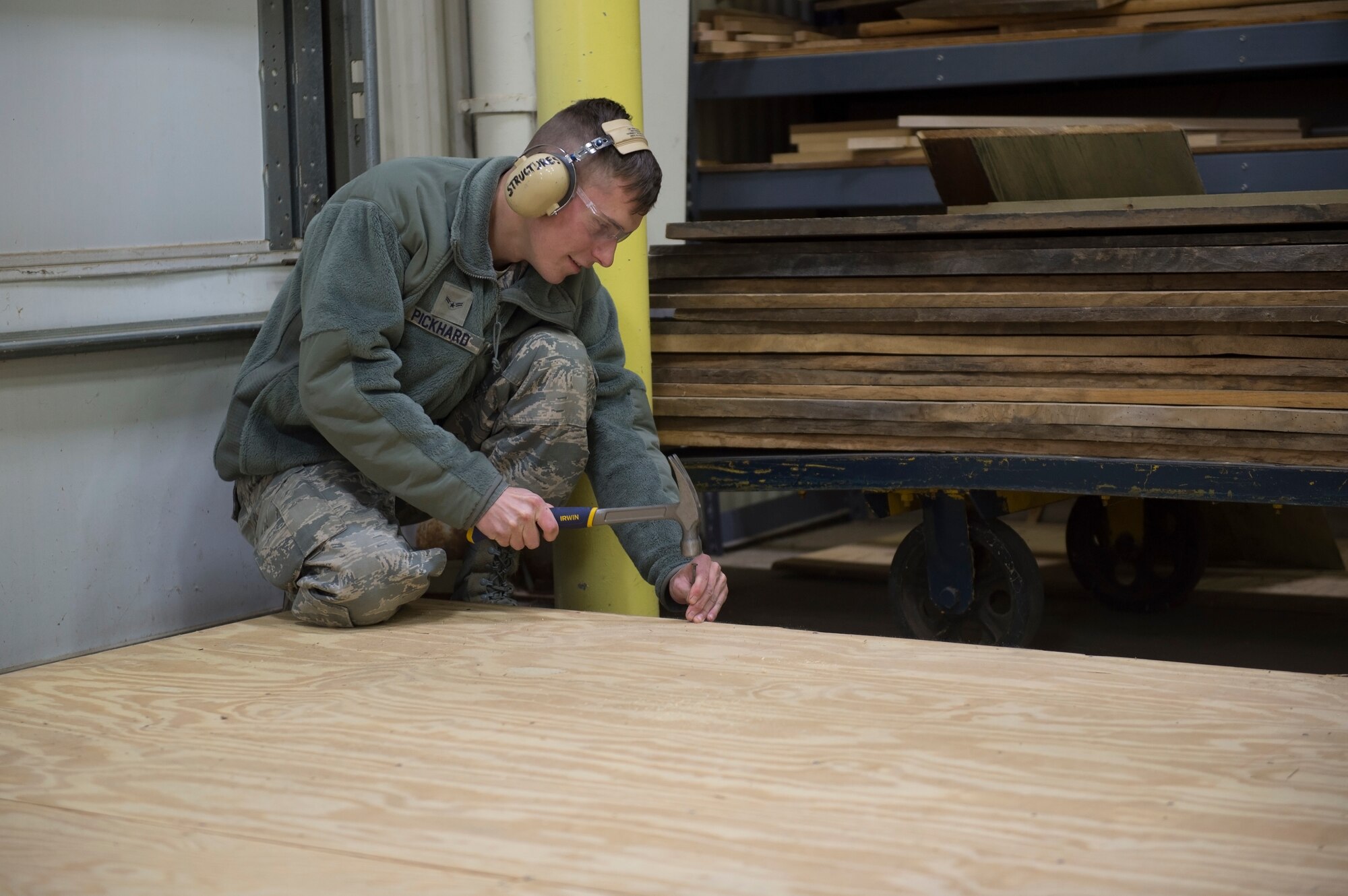 Airman 1st Class Austin Pickhard, 434th Civil Engineering Squadron structural helper, puts the finishing touches on the floor of a doll house Grissom Air Reserve Base, Indiana Nov. 3, 2019. The doll house is one of many bivouac operations that are used for training and exercise purposes here. (U.S. Air Force photo/Tech. Sgt. Jami K. Lancette)