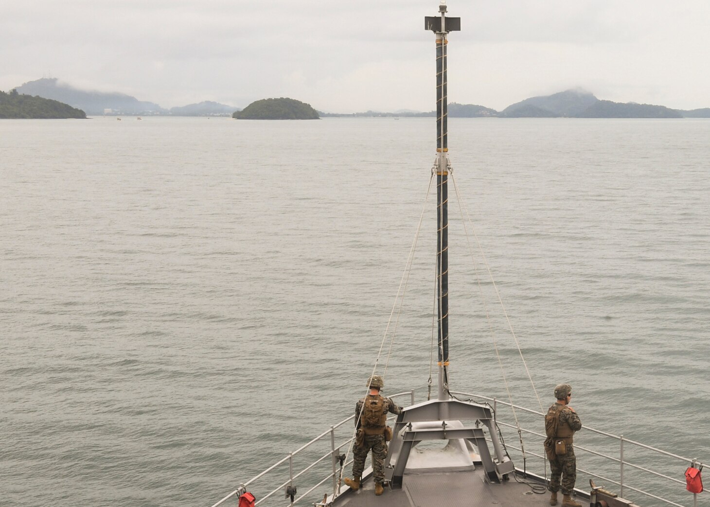 PHUKET, Thailand (Nov. 3, 2019) Marines, from 2nd Battalion, 2nd Marine Regiment, currently assigned to 3rd Marine Division, stand watch on the forecastle, as the Whidbey Island-class dock landing ship USS Germantown (LSD 42) prepares to anchor near Phuket, Thailand.  Germantown, part of Commander, Amphibious Squadron 11, is deployed to the Indo-Pacific region to enhance interoperability with partners and serve as a ready-response force for any type of contingency.