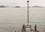 PHUKET, Thailand (Nov. 3, 2019) Marines, from 2nd Battalion, 2nd Marine Regiment, currently assigned to 3rd Marine Division, stand watch on the forecastle, as the Whidbey Island-class dock landing ship USS Germantown (LSD 42) prepares to anchor near Phuket, Thailand.  Germantown, part of Commander, Amphibious Squadron 11, is deployed to the Indo-Pacific region to enhance interoperability with partners and serve as a ready-response force for any type of contingency.