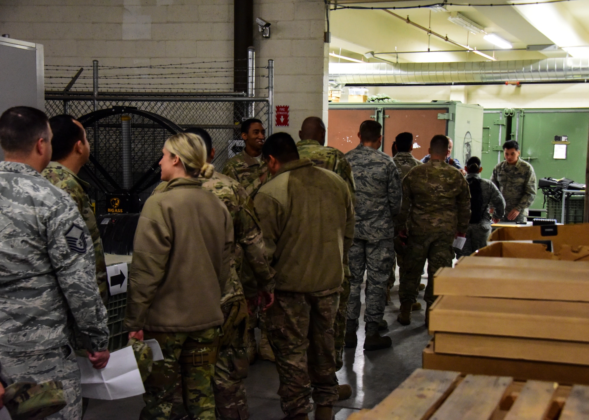 Airmen wait at weapons issue