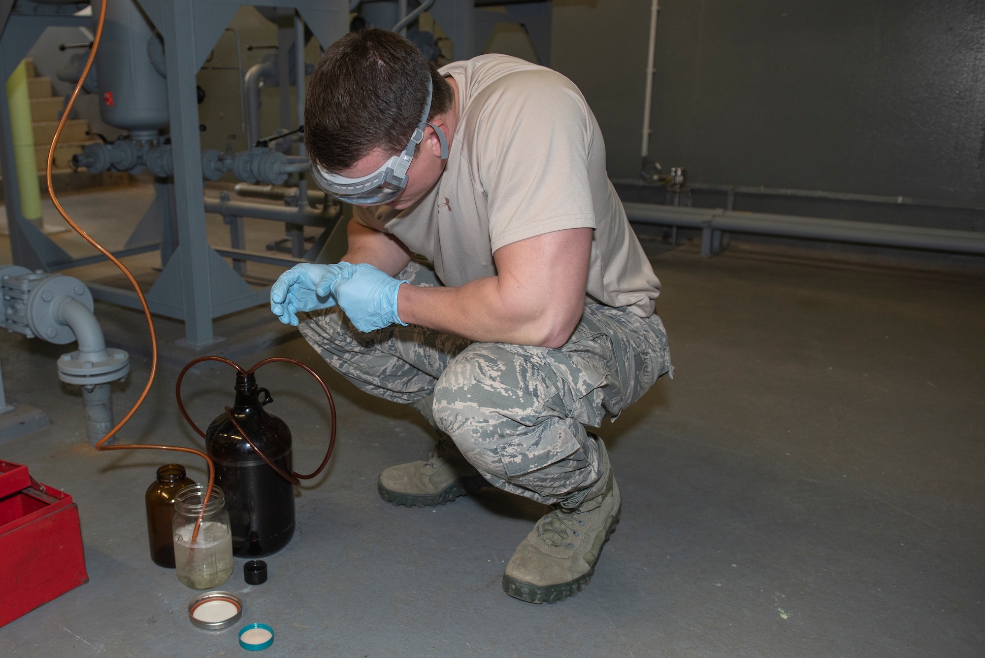 U.S. Air Force Senior Airman Joshua Skroch, 52nd Logistics Readiness Squadron petroleum, oil, and lubricants journeyman, collects a sample of JP-8 fuel for testing at Spangdahlem Air Base, Germany, Oct. 29, 2019. Fuel samples are collected to test for any traces of water or additives. (U.S. Air Force photo by Airman 1st Class Alison Stewart)
