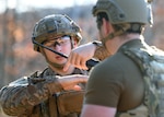 Staff Sgt. Kyle Doran, 104th Fighter Wing Explosive Ordnance Disposal technician, explains placement of an Improvised Explosive Device to Senior Airman Kyle Tracey, 104 FW EOD technician, during a four-day readiness exercise at Barnes Air National Guard Base in Westfield, Mass.