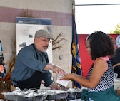 IMAGE: DAHLGREN, Va. (Oct. 30, 2019) – Naval Surface Warfare Center Dahlgren Division (NSWCDD) Technical Director John Fiore helps serve employees lunch during the command picnic. (U.S. Navy photo/Released)
