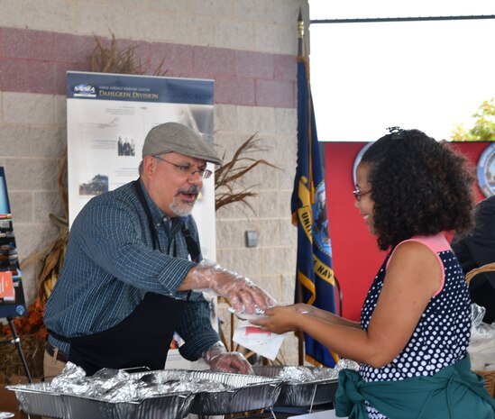 IMAGE: DAHLGREN, Va. (Oct. 30, 2019) – Naval Surface Warfare Center Dahlgren Division (NSWCDD) Technical Director John Fiore helps serve employees lunch during the command picnic. (U.S. Navy photo/Released)