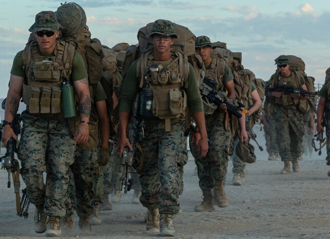 U.S. Marines with 7th Marine Regiment, 1st Marine Division conduct a hike on Camp Wilson, Marine Corps Air Ground Combat Center, Twentynine Palms, California, Nov. 2, 2019.  The regiment is participating as the adversary force in the execution of the MAGTF Warfighting Exercise 1-20. MWX is the largest unscripted, force-on-force, exercise conducted by the 2nd Marine Division in several decades.