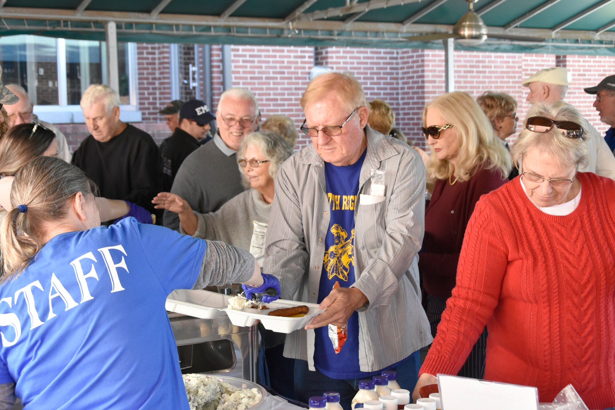 An attendee of the Oct. 18 Military Appreciation Day: Past, Present and Future event at the Arnold Lakeside Center receives a free lunch. The event, held annually at Arnold Air Force Base as a way to say “thank you” to veterans and active-duty service members and their families, featured a free lunch buffet that included hamburgers and hot dogs. (U.S. Air Force photo by Bradley Hicks)