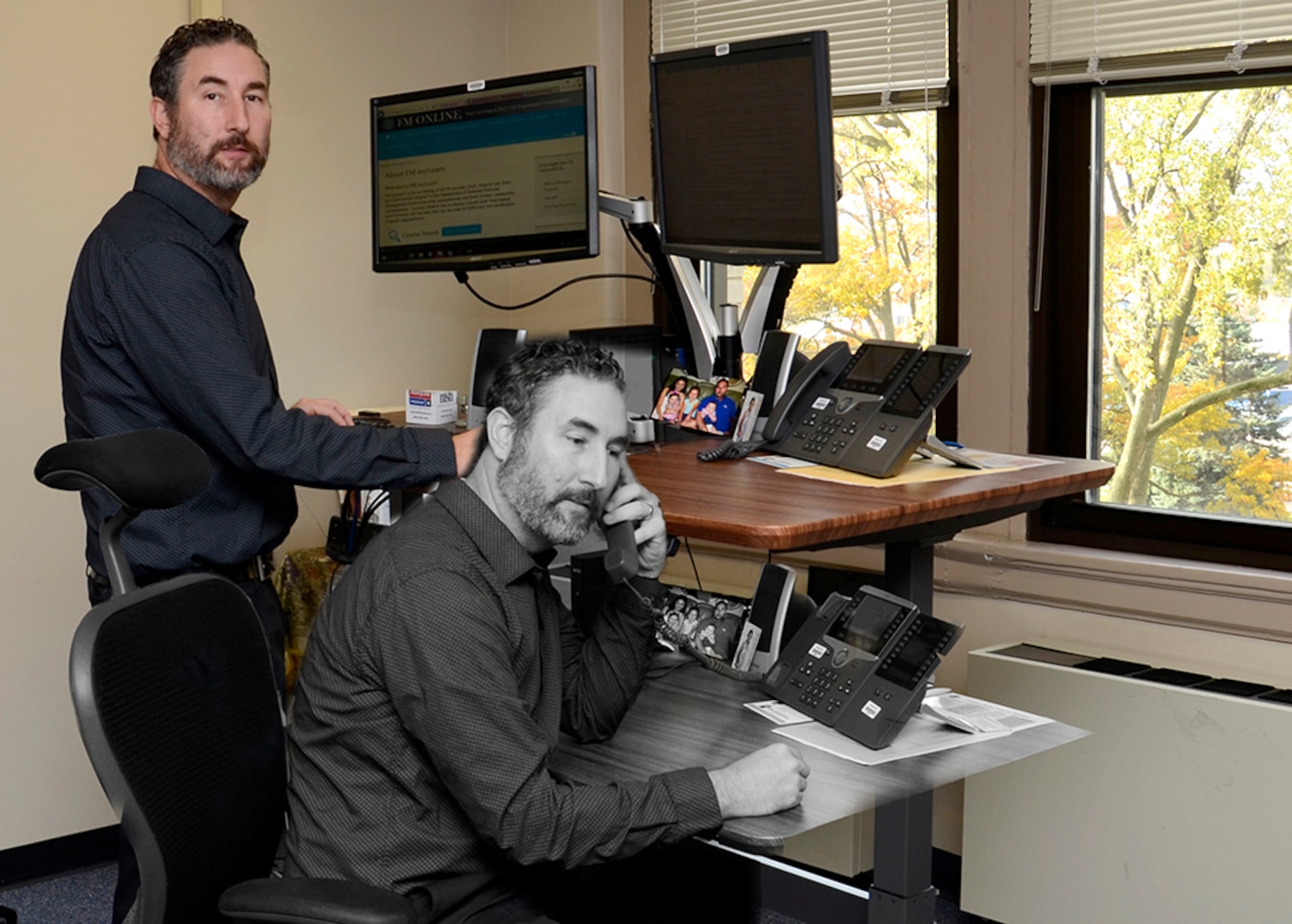 DLA Disposition Services Finance Director Isaac Stanley received his first sit-stand desk in June and said the work space flexibility has improved his posture and lessened back pain. Photo illustration.