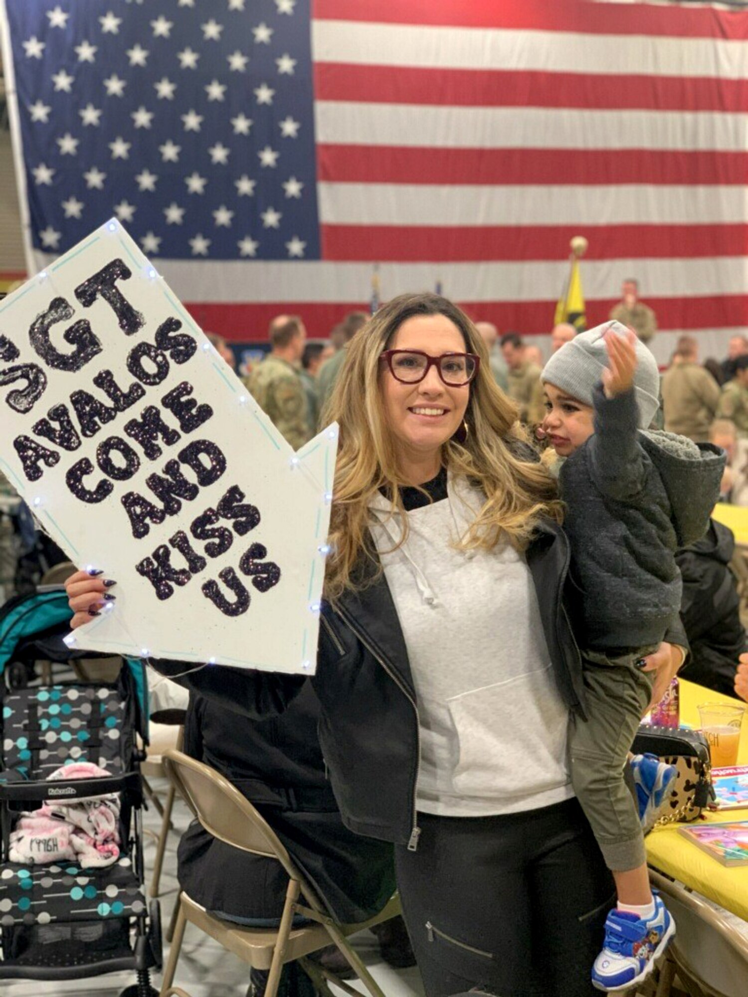 Staff Sgt. Jessica Avalos, a reservist in the 419th Aircraft Maintenance Squadron, and her two-year-old son, Rowan, prepare to greet Staff Sgt. Leonard Avalos, of the 388th Maintenance Squadron, upon his return from a six-month deployment to Al Dhafra Air Base, United Arab Emirates.