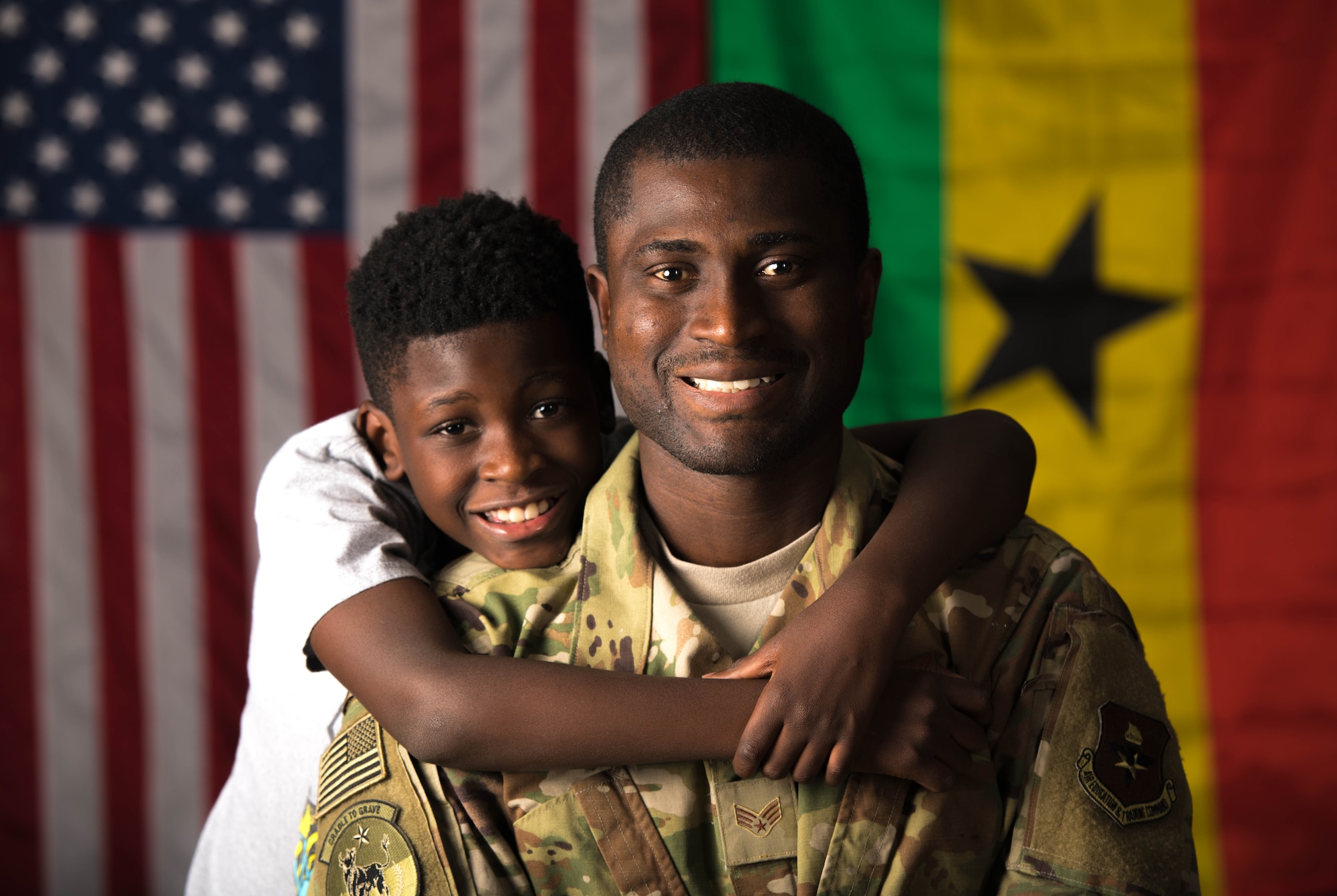 U.S. Air Force Senior Airman Akwasi Agyeman-Prempeh, 56th Force Support Squadron storeroom apprentice, and his son Kofi pose for a photo Oct. 23, 2019 at Luke Air Force Base, Ariz.