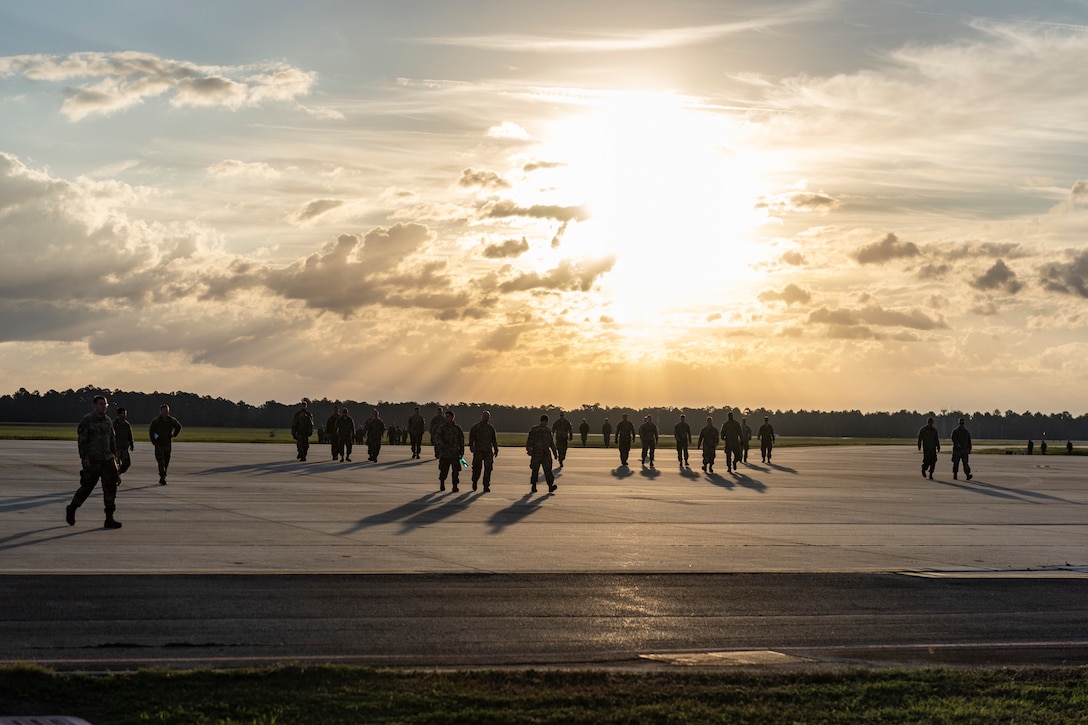 Airmen assigned to the 23d Wing gather for a foreign object debris (FOD) walk Nov. 4, 2019, at Moody Air Force Base, Ga. FOD is considered to be any foreign substance that could potentially cause damage to an aircraft. After the 2019 Thunder Over South Georgia Open House, Airmen with the 23d Wing conducted a FOD walk across the airfield to ensure safe operations for Moody's aircraft. (U.S. Air Force photo by Airman 1st Class Hayden Legg)
