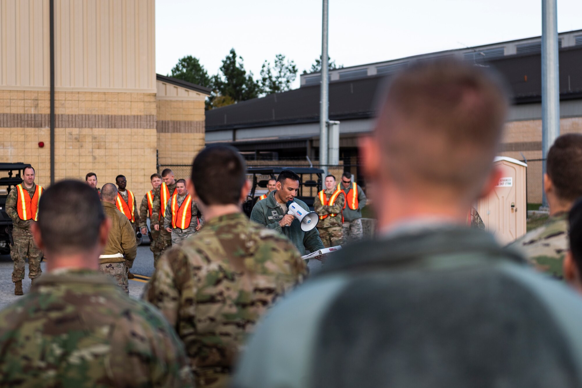 A photo of the 23d Wing vice commander briefing Airmen before a foreign object debris walk across the airfield