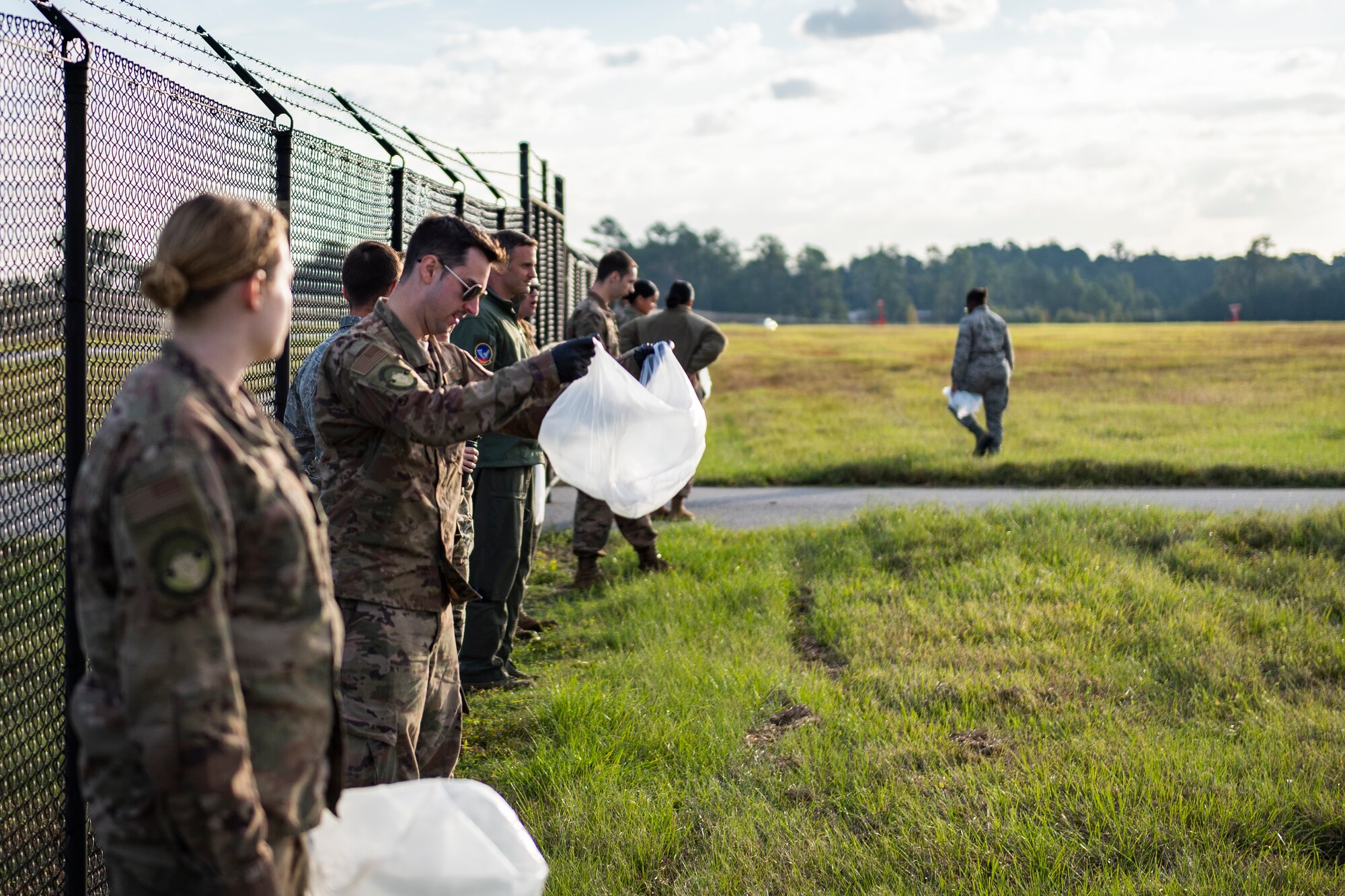 A photo of Airmen preparing to conduct a foreign object debris walk across the airfield