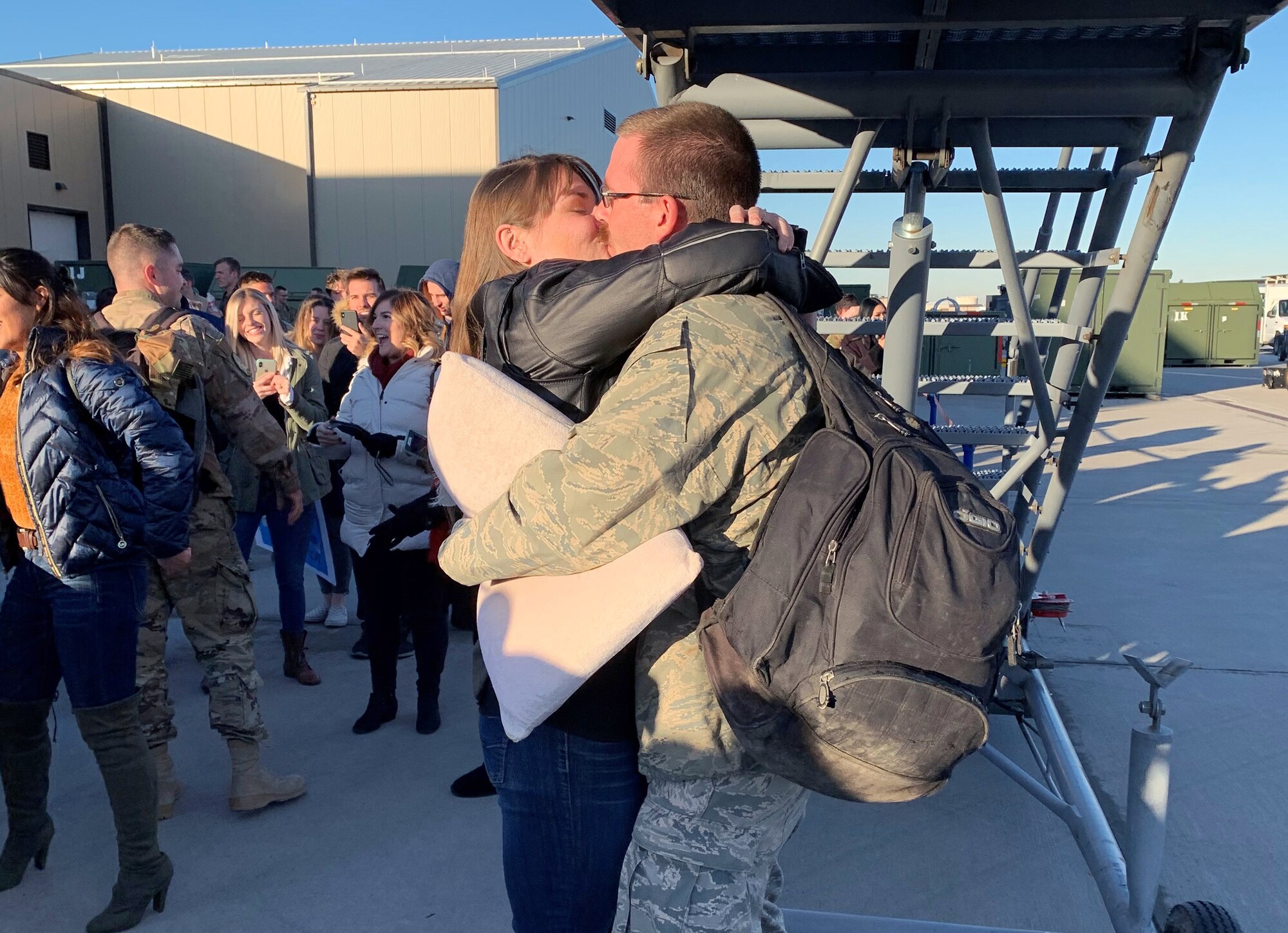 Tech. Sgt. Logan Everton embraces girlfriend, Kyleah Adamson, upon arriving home following a six-month deployment to Al Dhafra Air Base, United Arab Emirates.