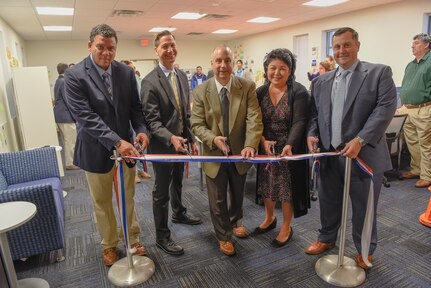 From left: Matt Early, branch head for Information Technology Operations; Garth Jensen, director of innovation; Larry Tarasek, technical director; Anna Eshbaugh, branch head for Information Management Customer Service; and Mike Kirby, command information officer cut the ribbon to the new Rapid Innovation Center at Naval Surface Warfare Center Carderock Division on Oct. 29, 2019, in West Bethesda, Md. (U.S. Navy photo by Harry Friedman/Released)