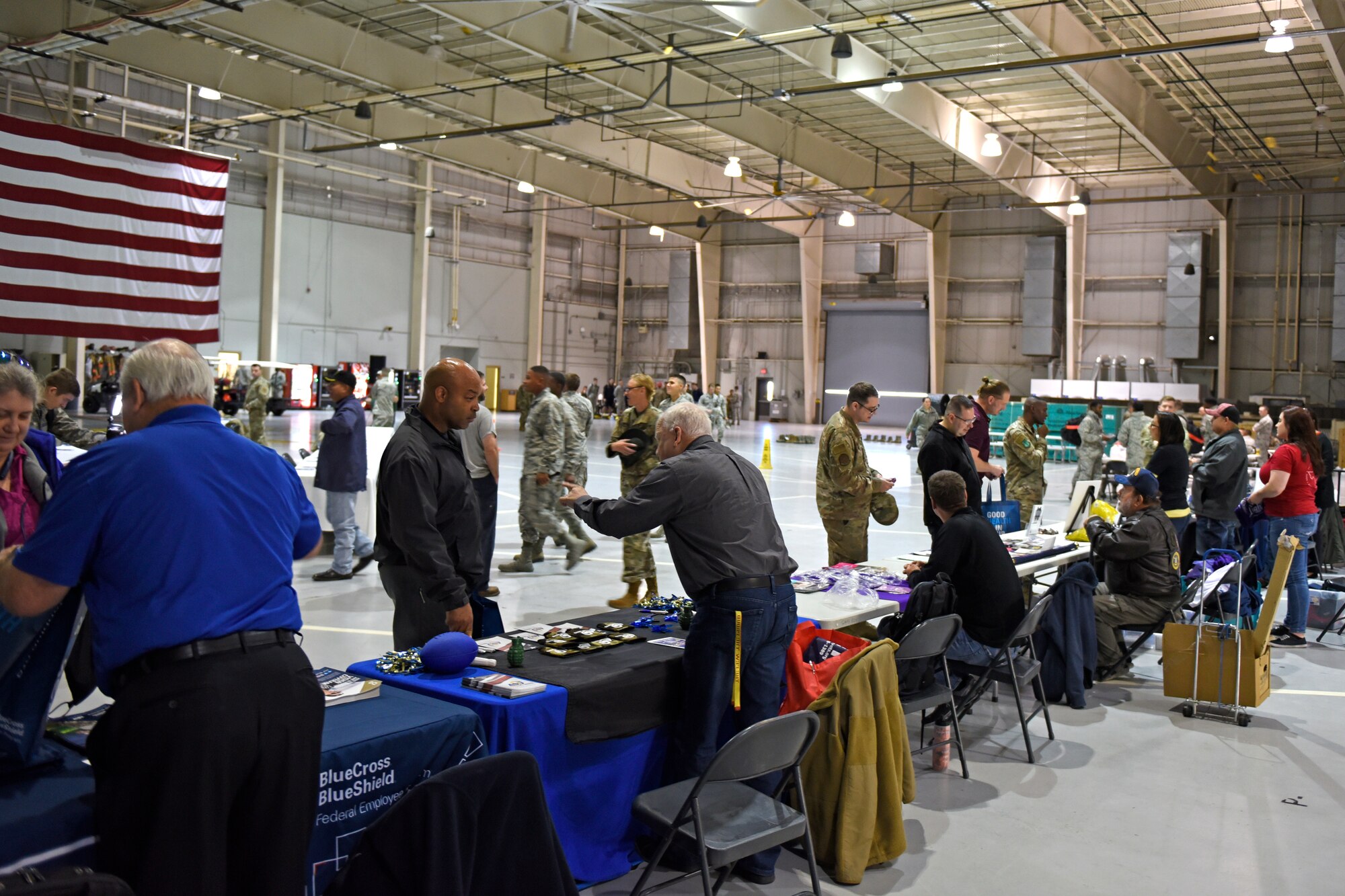 Attendees visit booths set up by local organizations during the Retiree Appreciation Day event at the Louis F. Garland Department of Defense High Bay, Goodfellow Air Force Base, Texas, Nov. 1, 2019. The event emphasized health and wellness of the retirees and prepared those retiring soon for what to expect. (U.S Air Force photo by Airman 1st Class Zachary Chapman/Released)