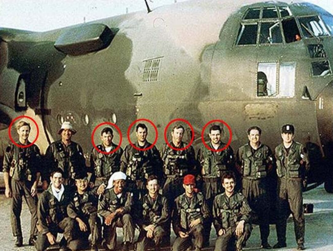 Men pose for photo in front of plane. Circles identify five men who were killed in an accident.