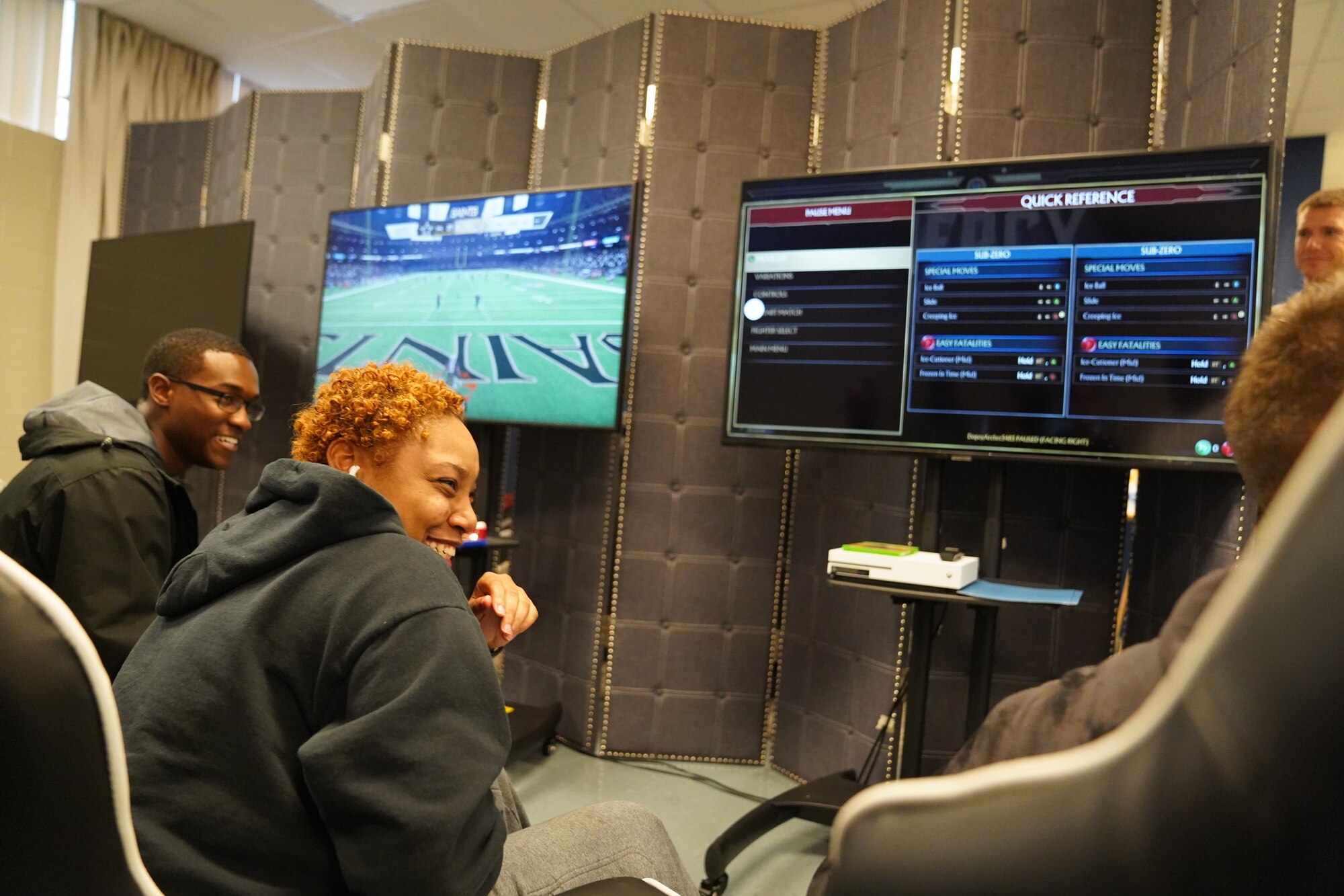 Keesler Airmen laugh during the opening of The Lighthouse inside the Larcher Chapel at Keesler Air Force Base, Mississippi, Nov. 1, 2019. The Lighthouse is a place dedicated to permanent party Airmen complete with gaming stations, massage chairs, a kitchen, and a music room. The idea of the lighthouse stemmed from a meeting Col. Heather Blackwell, 81st Training Wing commander, had with some of Keesler's dorm residents in August. (U.S Air Force photo by Airman 1st Class Spencer Tobler)