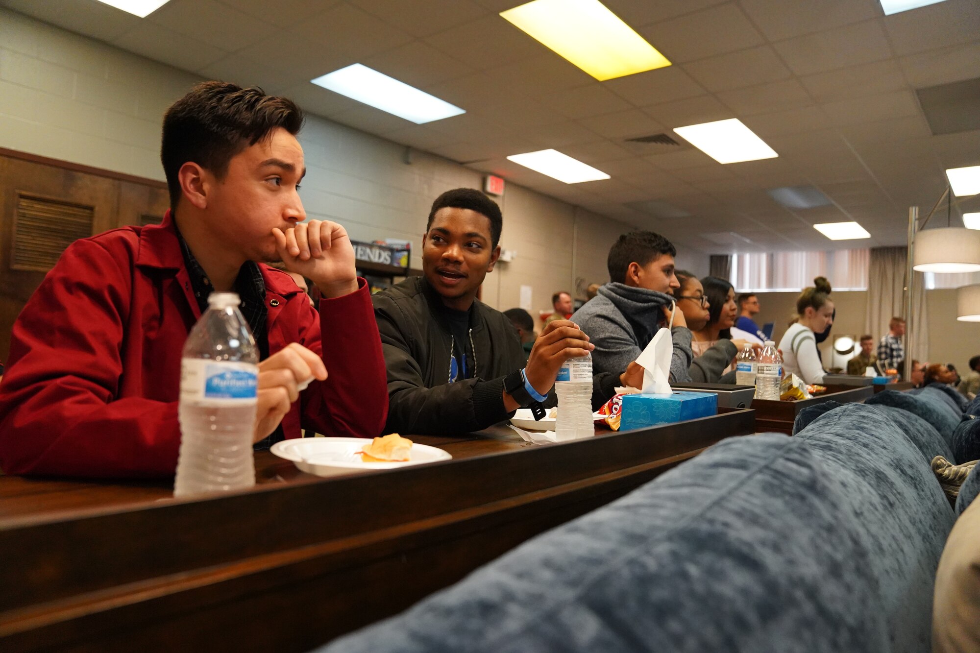 Keesler Airmen converse during the opening of The Lighthouse inside the Larcher Chapel at Keesler Air Force Base, Mississippi, Nov. 1, 2019. The Lighthouse is a place dedicated to permanent party Airmen complete with gaming stations, massage chairs, a kitchen, and a music room. The idea of The Lighthouse stemmed from a meeting Col. Heather Blackwell, 81st Training Wing commander, had with some of Keesler's dorm residents in August. (U.S Air Force photo by Airman 1st Class Spencer Tobler)