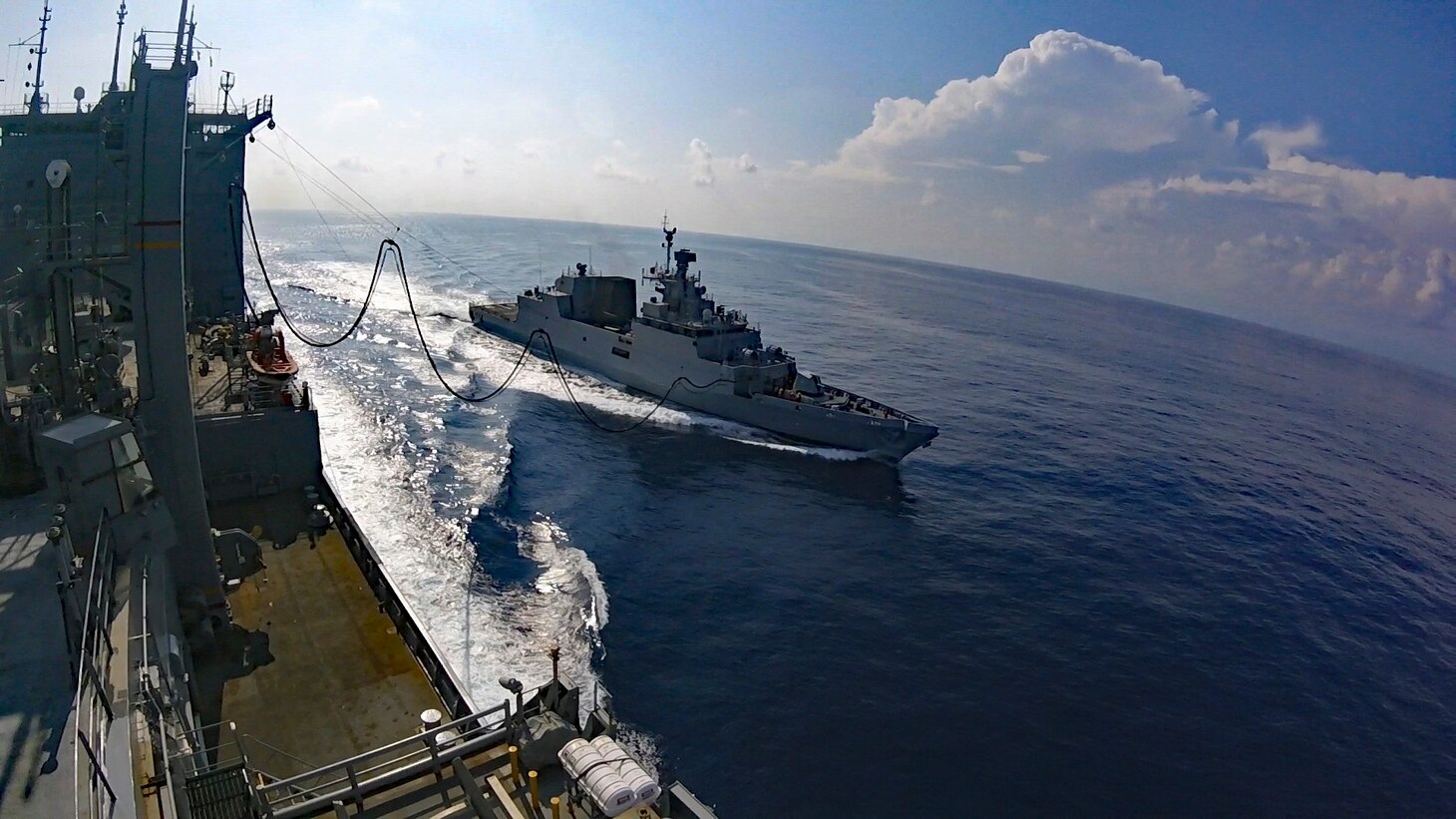 SOUTH CHINA SEA (Nov. 1, 2019) - Military Sealift Command's Lewis and Clark-class dry cargo and ammunition ship USNS Richard E. Byrd (T-AKE 4) steams alongside the Indian Navy's anti-submarine warfare corvette INS Kiltan (P 30) during a replenishment at sea. The U.S. Navy regularly operates with allies and partners, both bilaterally and multilaterally to promote security and stability throughout the Indo-Pacific region.