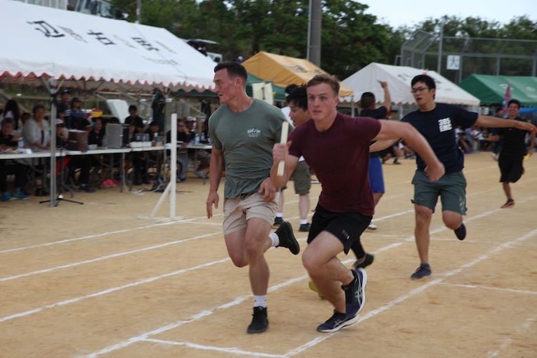 Marines participate in 4x200 meter relay during the 46th Henoko Sports Festival at Henoko athletic field Nov. 3, 2019, Camp Schwab and Okinawa Defense Bureau were invited to participate in the event.