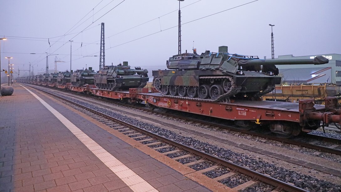 Military enthusiasts watches as French tanks roll into German Town