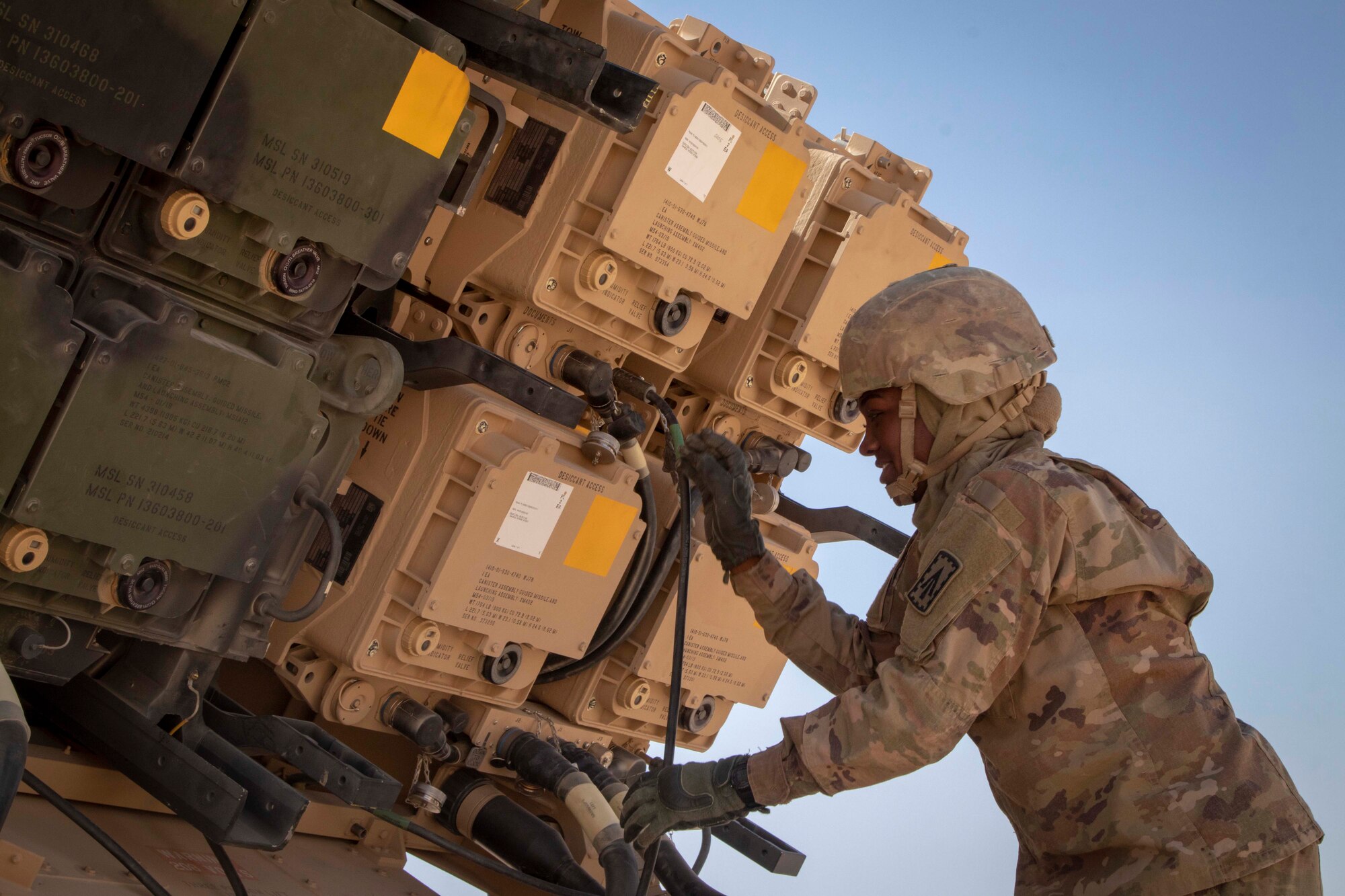 U.S. Army Pfc. Maya Richardson, a Patriot Launching Station Enhanced Operator-Maintainer assigned to Charlie Battery, 3rd Battalion, 4th Air Defense Artillery, 108th Air Defense Artillery Brigade, inspects the cables to her assigned MIM-104 Patriot missile system.