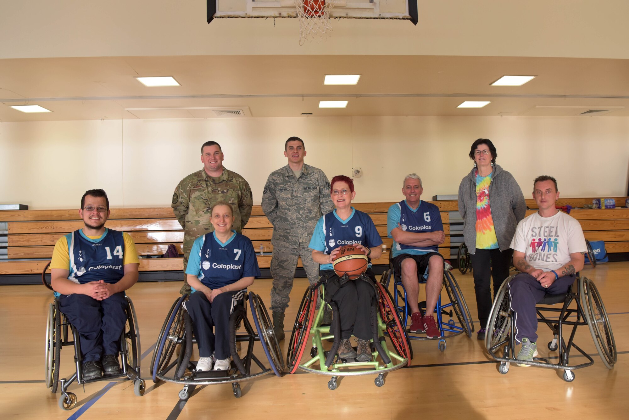 Team Mildenhall Airmen, members of the Hereward Heat wheelchair basketball club, and a volunteer from Steel Bones charity organization pose for a photo at RAF Mildenhall, England, Oct. 30, 2019. October has been designated as National Disability Employment Awareness Month, to educate people about disability employment as well as to recognize the contributions of employees with disabilities. (U.S. Air Force photo by Senior Airman Benjamin Cooper)