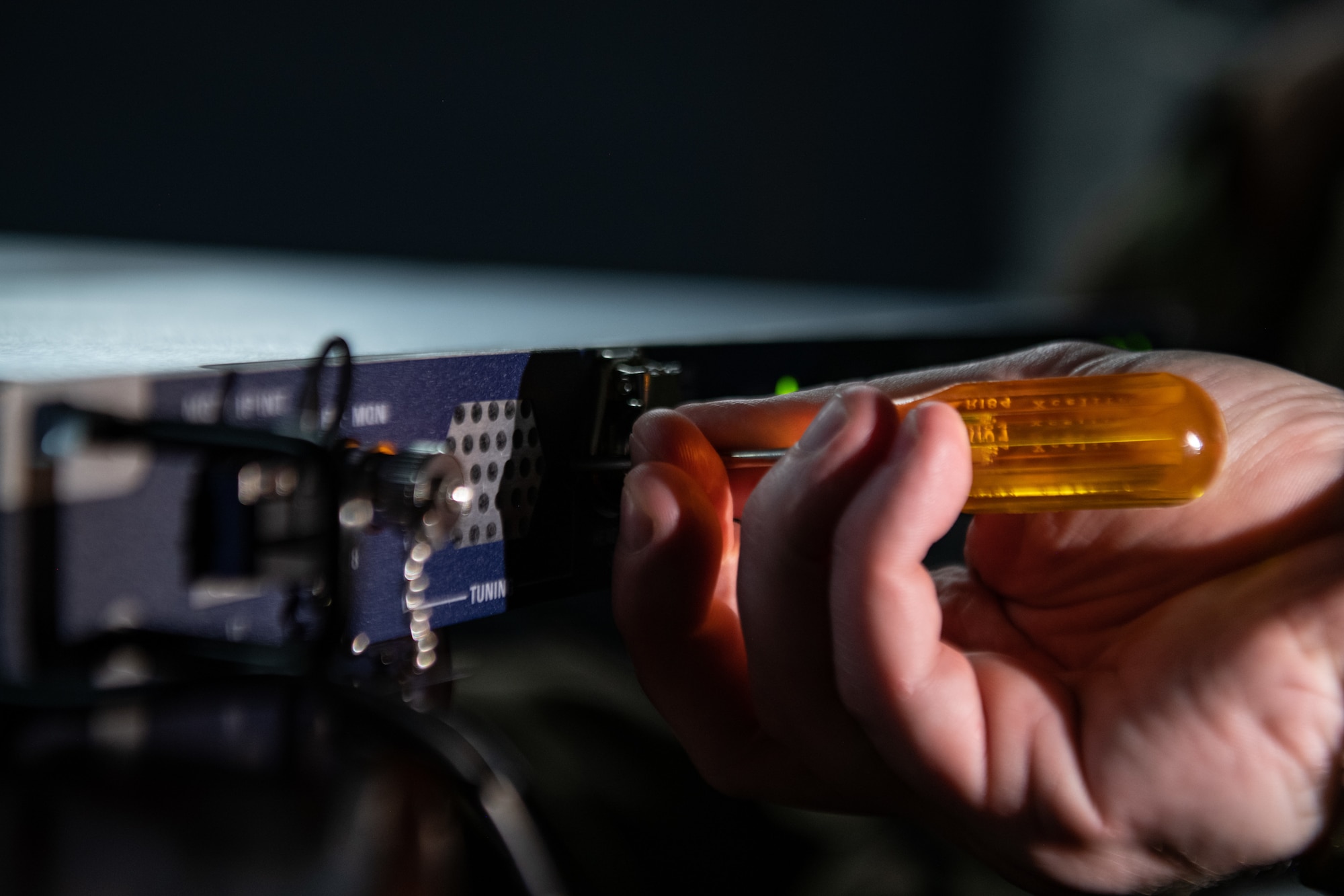 A screwdriver is used to tune a CM-300 digital receiver that will be installed in the 36th Operations Support Squadron air traffic control tower at Andersen Air Force Base in Guam on Sept. 15, 2019. The 205th EIS had seven Airmen working to install ten CM-300/350 radios in the 36th Operations Support Squadron air traffic control tower as part of the U.S. Air Force Air Traffic Control and Landing Systems Radio Replacement Program. (U.S. Air National Guard photo by Staff Sgt. Brigette Waltermire)