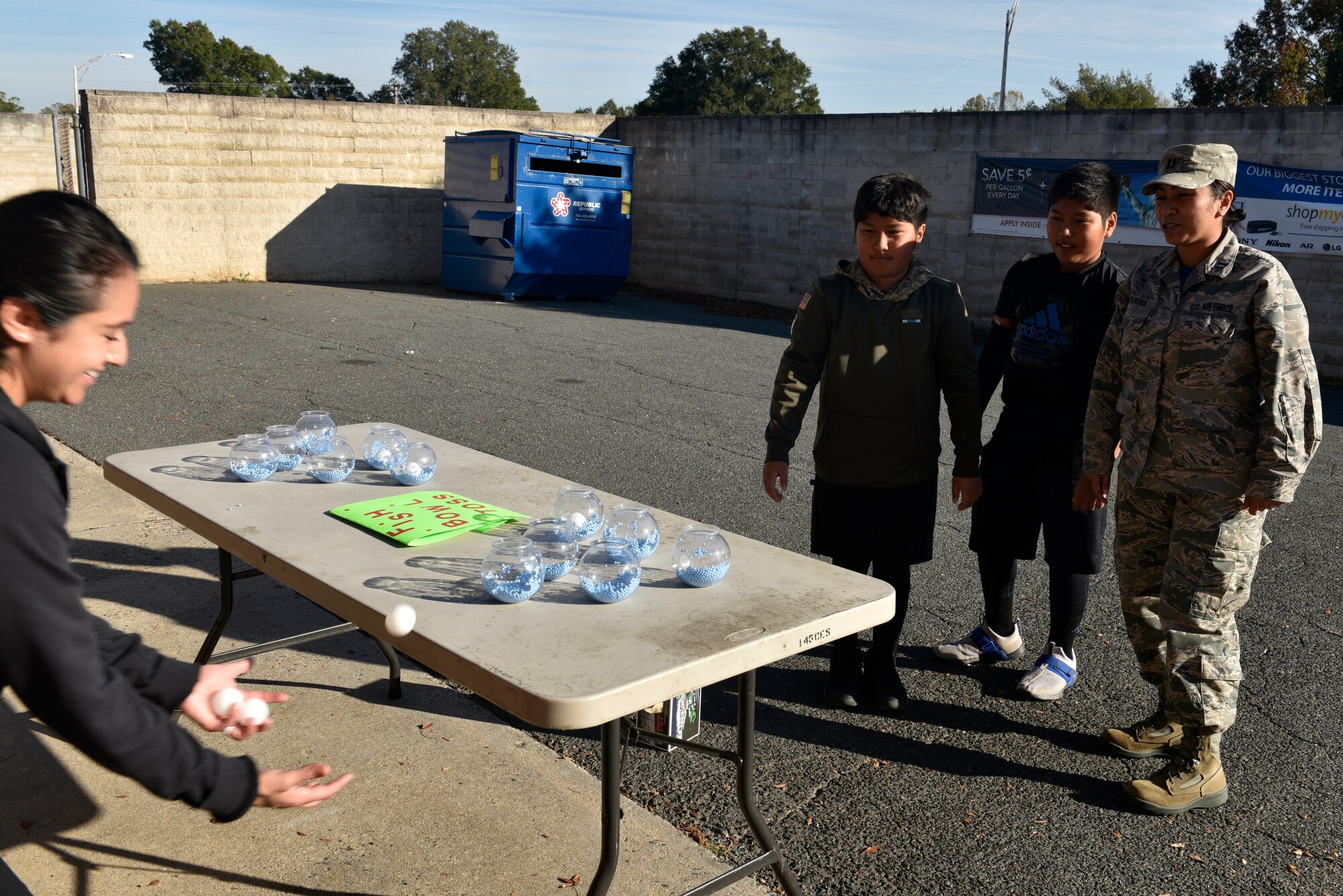 A family participates in an activity booth during a Fall Festival put together by the Junior Enlisted Council (JEC) at the North Carolina Air National Guard (NCANG) Base, Charlotte Douglas International Airport, Nov. 2, 2019. The Fall Festival is a first-time event for the JEC and NCANG that is hoped to be held for years to come.