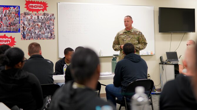 Senior Master Sgt. Robert Elliot, military training instructor recruiter for the 433rd Training Squadron at Lackland Air Force Base, Texas, speaks to trainees from the 403rd Wing's Development and Training Flight at Keesler Air Force Base, Miss., Nov. 3, 2019. Here for recruiting purposes, Elliot took time out of his day to answer any questions about basic military training and MTI opportunities. (U.S. Air Force photo by Senior Airman Kristen Pittman).