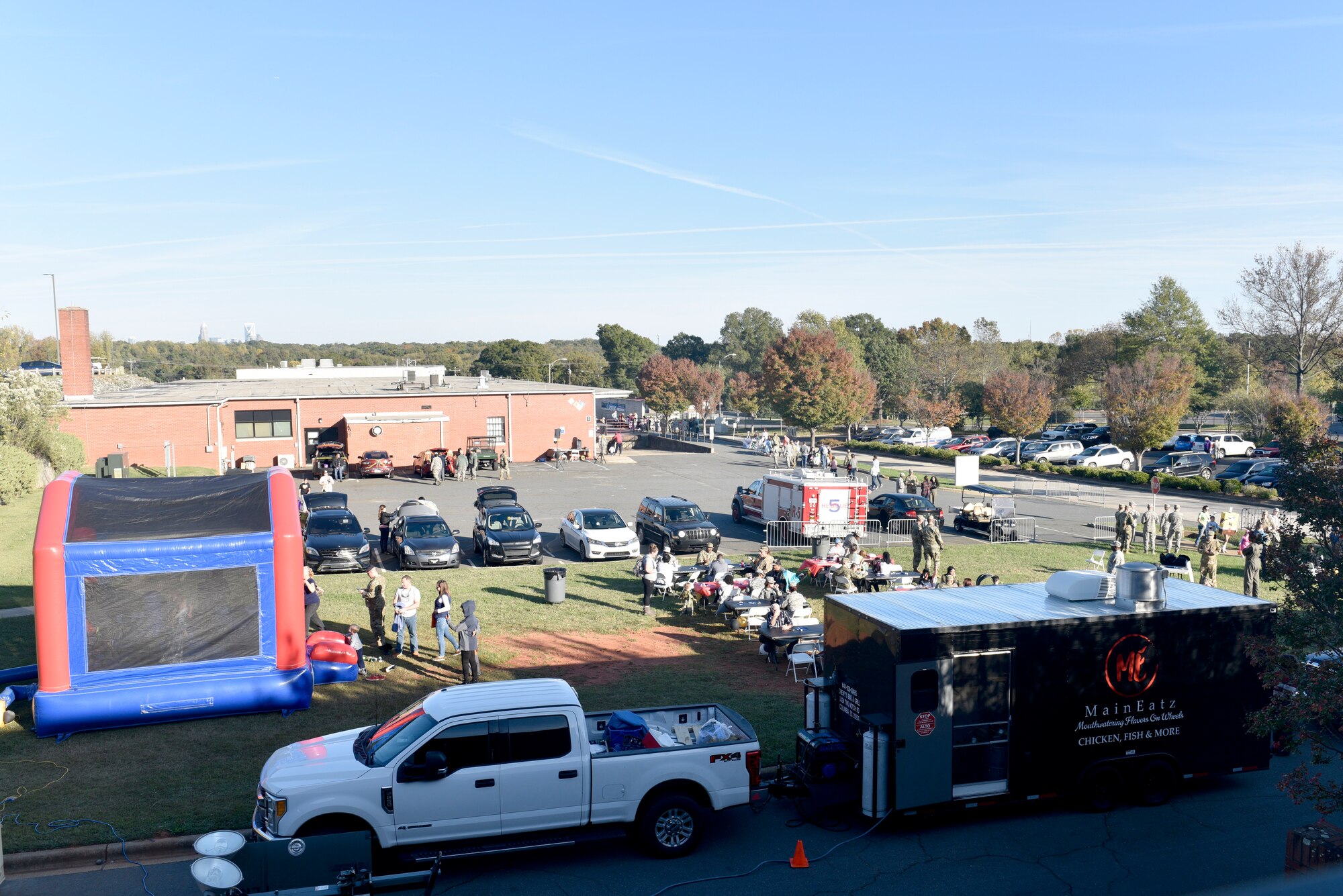 Families and members of the North Carolina Air National Guard mill around various stations during a Fall Festival put together by the Junior Enlisted Council (JEC) at the North Carolina Air National Guard (NCANG) Base, Charlotte Douglas International Airport, Nov. 2, 2019. The Fall Festival is a first-time event for the JEC and NCANG that is hoped to be held for years to come.