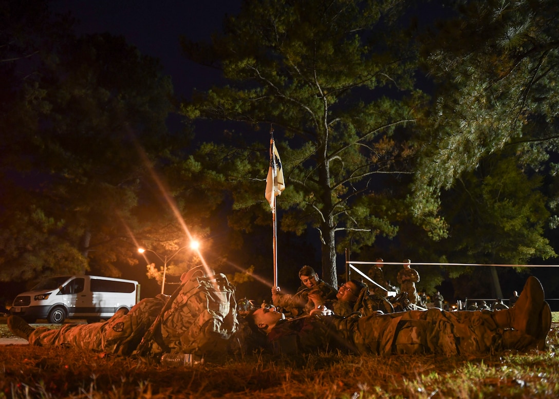 U.S. Army Soldiers rest after completing the Norwegian Foot March at Joint Base Langley-Eustis, Virginia, Oct. 30, 2019.