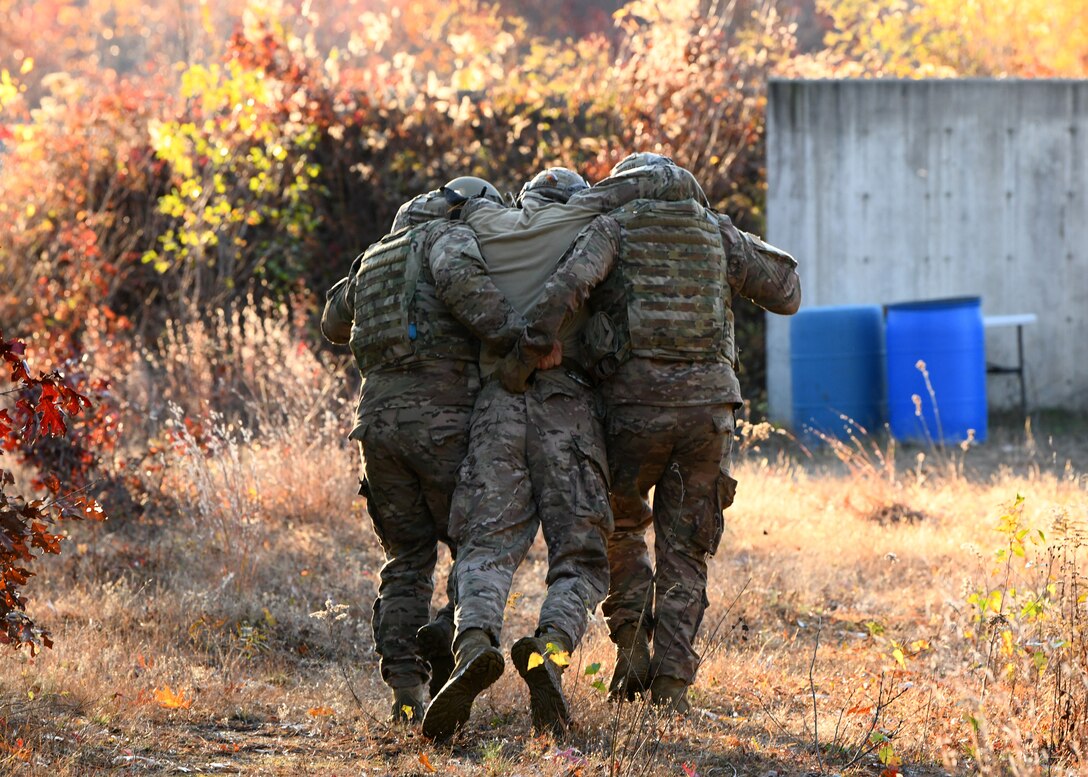 The 104th Fighter Wing Explosive Ordnance Disposal Airmen ran through simulated Improvised Explosive Device drills during a four day readiness exercise. The Airmen switched between MOPP 2 and MOPP 4 in order to better prepare for potential CBRN attacks in contested environments. (U.S. Air National Guard photo by Airman 1st Class Sara Kolinski)