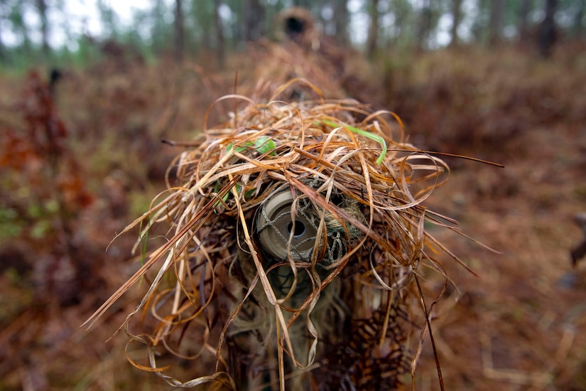 A view of a sniper’s weapon looking down the barrel.