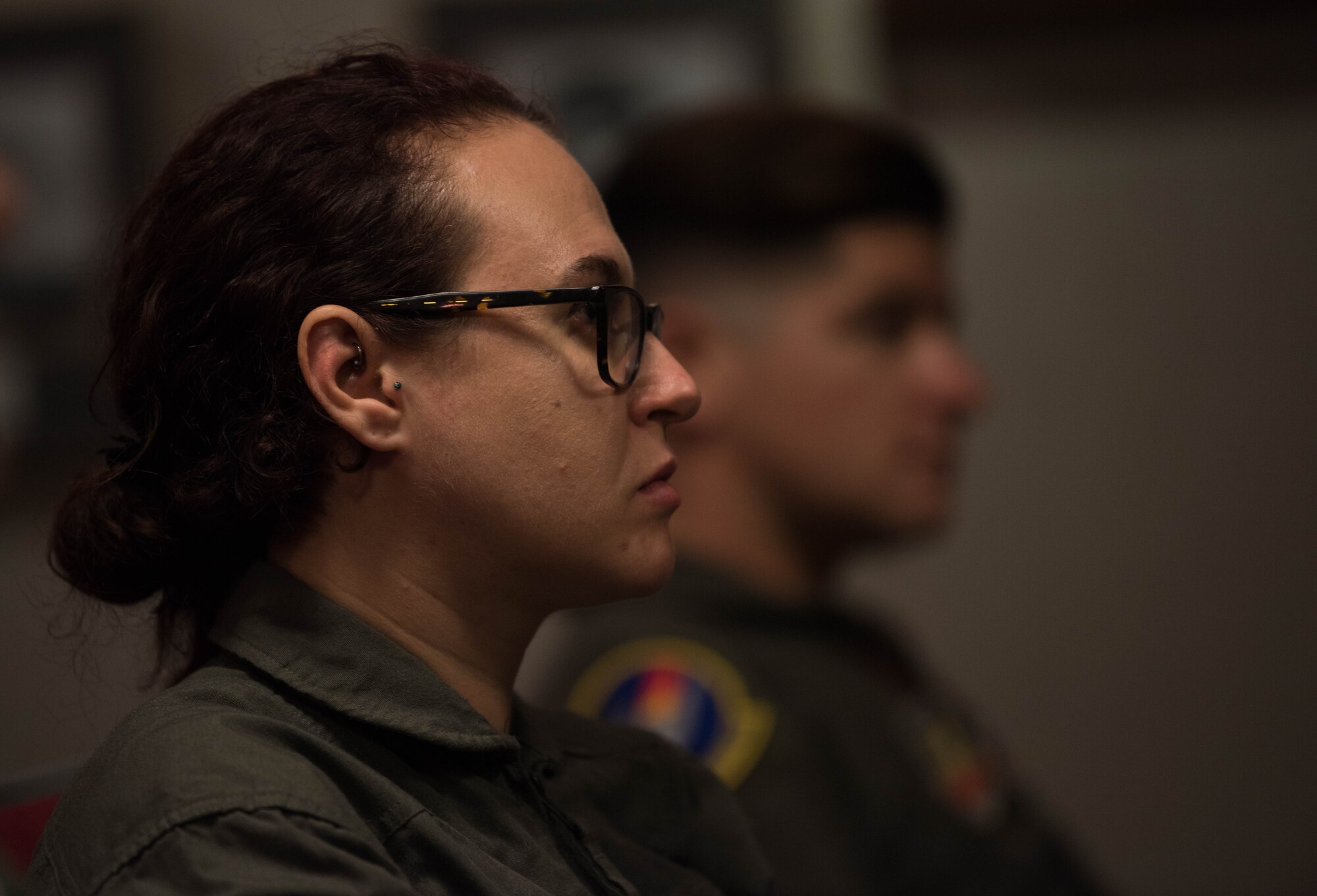Vivienne Machi, Defense Daily reporter, listens to a pilots’ briefing at Joint Base Langley-Eustis, Virginia, Oct. 31, 2019. Machi completed the required training needed to ride in a U.S. Air Force T-38A Talon during adversary air training. (U.S. Air Force photo by Airman 1st Class Sarah Dowe)