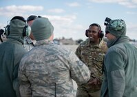 Members of the 166th Aircraft Maintenance Squadron celebrate after watching four C-130H2 aircraft take off from the flightline at New Castle Air National Guard Base, Del., Nov. 3, 2019. The Mission Capability Rate for the 166th Airlift Wing is approaching the best it’s been since the June 2018 AEF rotation. (U.S. Air National Guard photo by Staff Sgt. Katherine Miller)