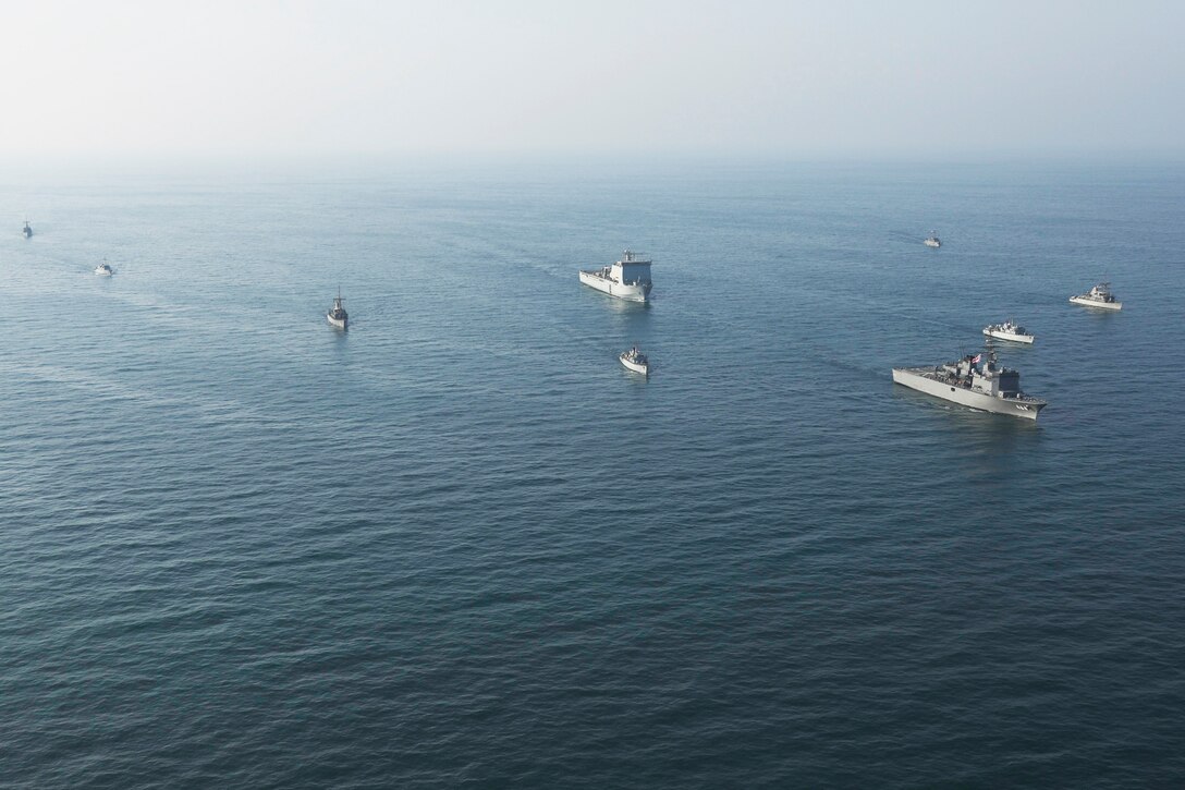 ARABIAN GULF (Nov.4, 2019) Ships participating in International Maritime Exercise (IMX) 2019 steam in close formation.IMX19 is a multinational engagement involving partners and allies from around the world in sharing knowledge and experiences across the full spectrum of defensive maritime operations. The exercise serves to demonstrate the global resolve in maintaining regional security and stability, freedom of navigation and the free flow of commerce from the Suez Canal south to the Bab-el-Mandeb through the Strait of Hormuz to the Northern Arabian Gulf. (U.S. Army photo by Spc. Benjamin Castro/Released)