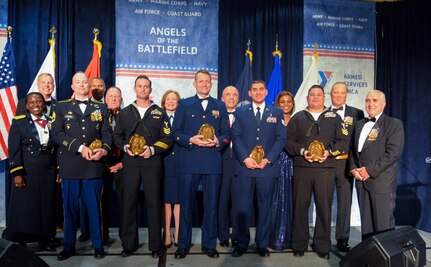 Recipients of the Angels of the Battlefield Awards Gala stand to receive their awards Oct. 29, 2019.