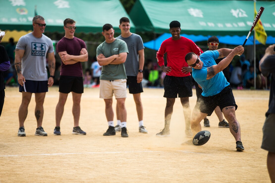 U.S. Marine Corps Staff Sgt. Garrett Burn, an engineer platoon sergeant with 4th Marine Regiment, 3rd Marine Division, participates in a rugby ball-handling relay competition during the 46th Annual Henoko District Citizen’s Track and Field Meet Sports Day in Henoko, Okinawa, Japan, Nov. 3, 2019. Personnel from Camp Schwab have been included in the track and field meet since 1973 and will carry on the tradition of good will and togetherness with the people of Henoko.