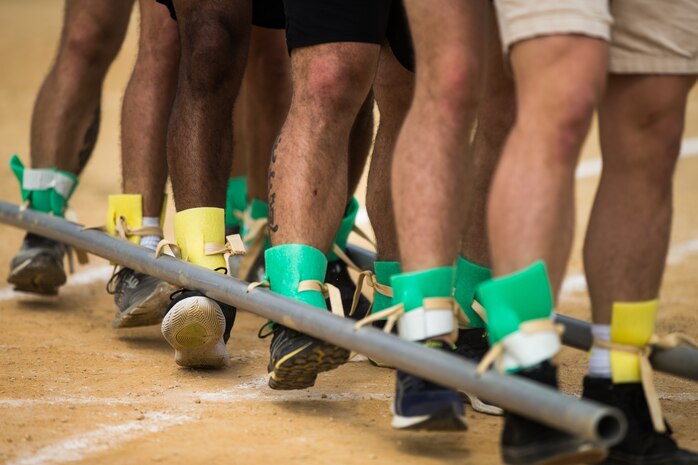 U.S. Marines with 4th Marine Regiment, 3rd Marine Division, compete in a centipede race during the 46th Annual Henoko District Citizen’s Track and Field Meet Sports Day in Henoko, Okinawa, Japan, Nov. 3, 2019. Personnel from Camp Schwab have been included in the track and field meet since 1973 and will carry on the tradition of good will and togetherness with the people of Henoko.