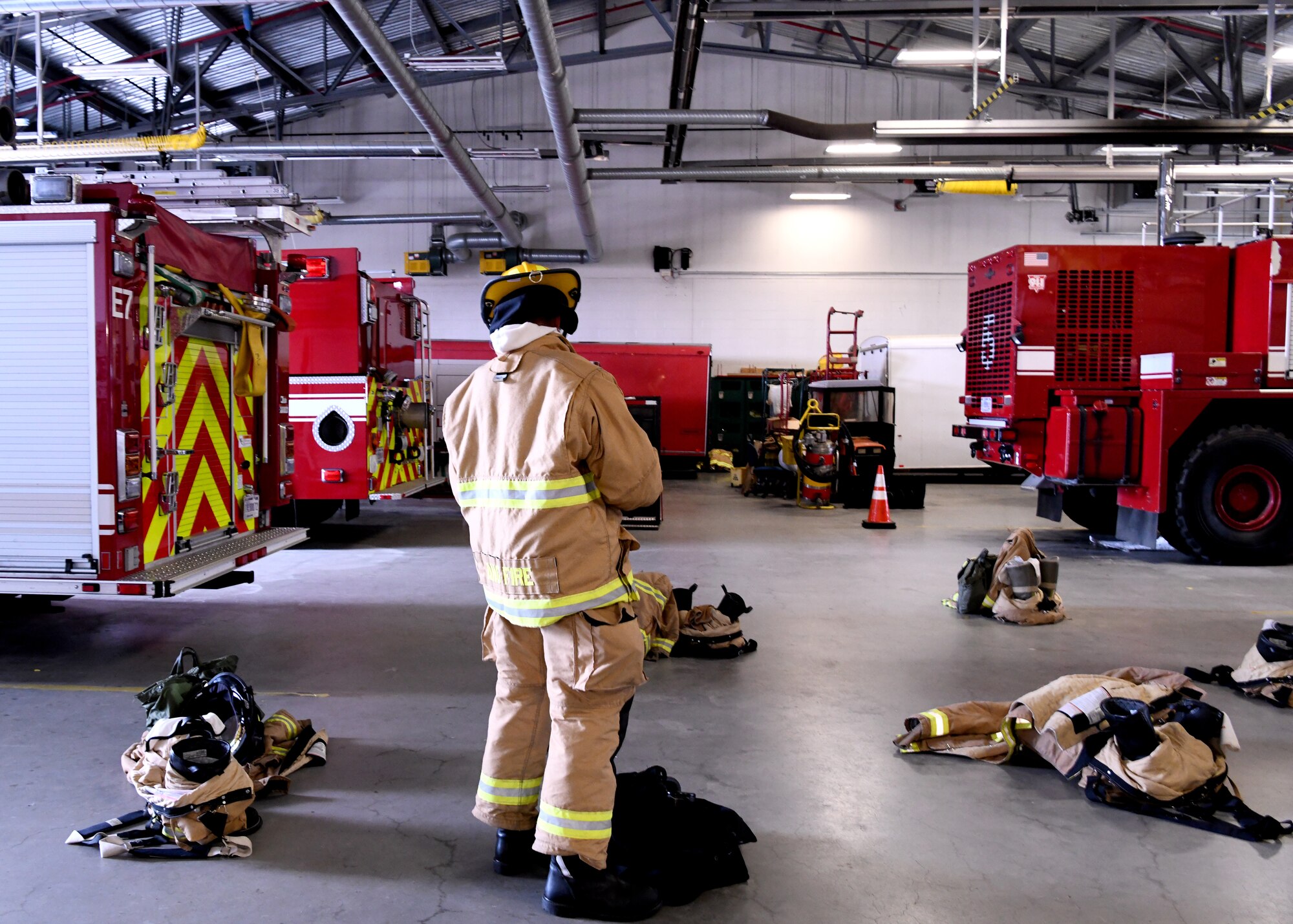 Firefighters from the 104 FW participate in fire prevention week on October 8, 2019. Staff Sgt. Sam Schrader, 104th firefighter puts on his gear. (U.S. Air National Guard photo by Airman Basic Camille Lienau)