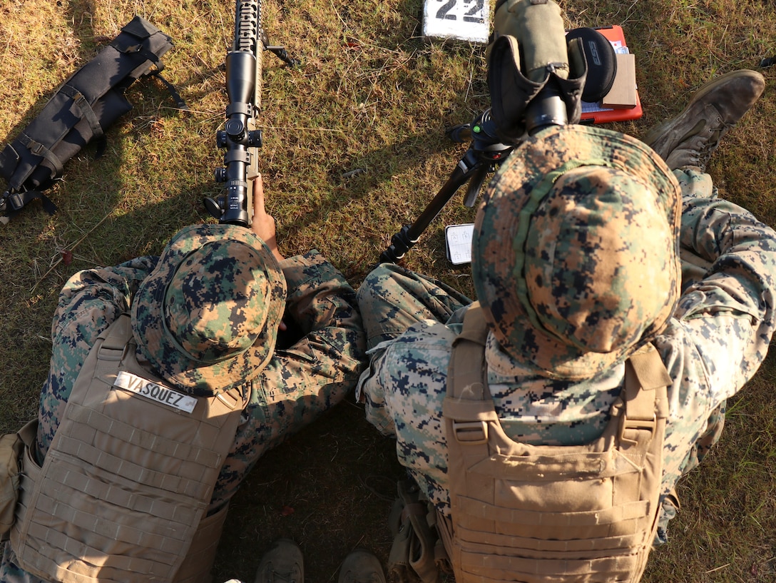 U.S. Marines assigned to Marine Corps Security Force Regiment participate in the unknown distance daytime course of fire during a Designated Marksmanship course Oct. 23, 2019, at Naval Weapons Station Yorktown, Yorktown, Virginia. The role of a Designated Marksman is to provide precision fire to the unit commander for Fleet Anti-terrorism Security Team companies and the Recapture Tactics Team. During the course, Marines learn basic designated marksman employment such as security posture, communications, multi-threat engagements, alternate shooting positions, as well as moving target, unknown distance, and limited visibility engagements.