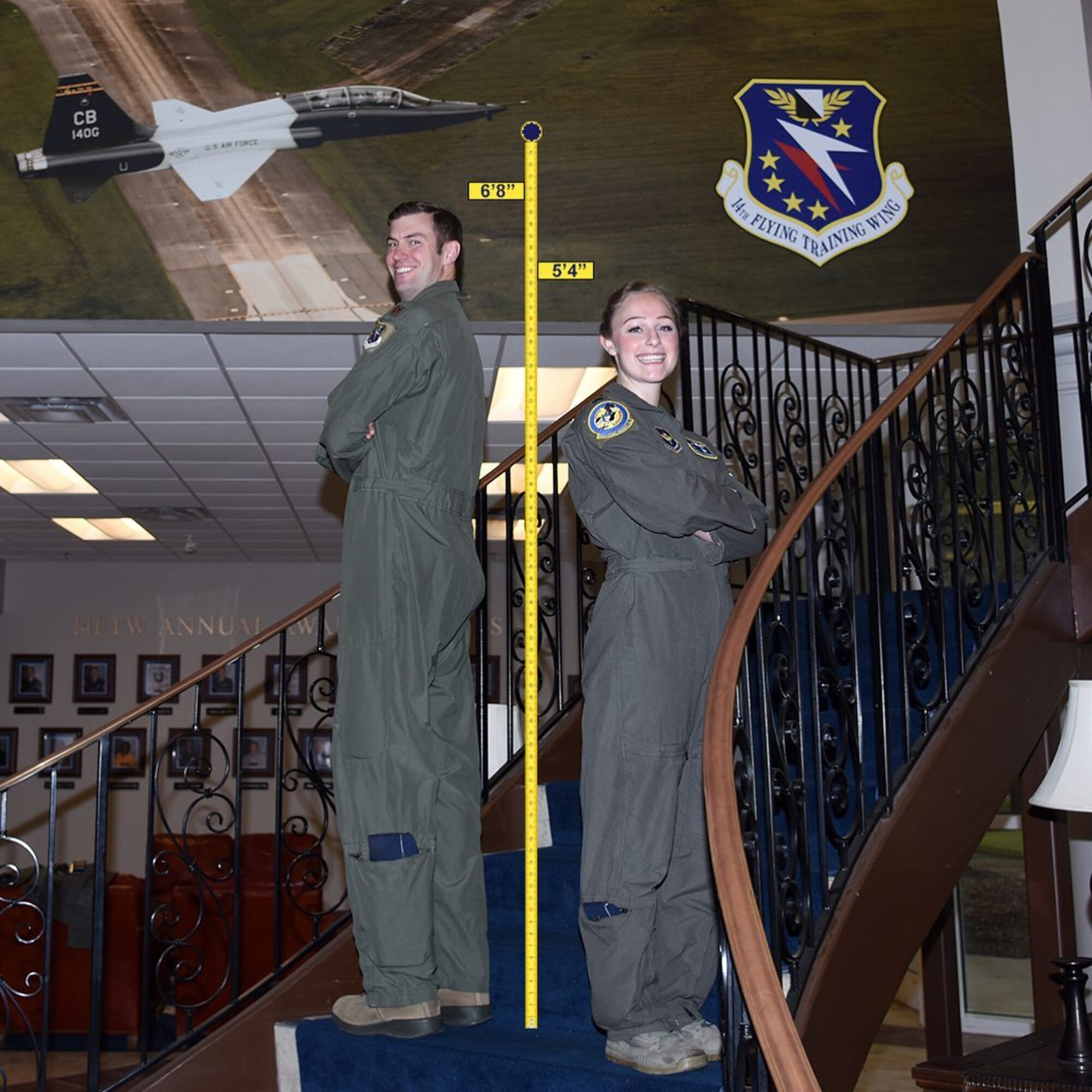 Two instructor pilots from the 14th Flying Training Wing at Columbus Air Force Base, Miss., stand side-by-side to illustrate the varying standing heights of Air Force pilots to dispel the myth that there is one height standard for all Air Force pilots.  Height waivers are available for candidates that do not meet AFI 48-123 standards. If you are interested in learning more about height waivers, work with your commission source or contact the Air Force Call Center at 1-800-423-USAF. (U.S. Air Force courtesy photo)
