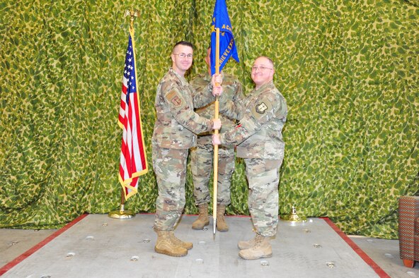 Lt. Col. Rodney E. McCraine, left, 403rd Mission Support Group commander, presents the guidon to Lt. Col. Jeffrey L. Frye, 41st Aerial Port Squadron commander, during the Assumption of Command ceremony of 41st Aerial Port Squadron at Keesler Air Force Base, Miss., Nov. 2. The 41st Aerial Port Squadron processes personnel and cargo to include rigging for airdrop, packing parachutes, loading equipment, and preparing air cargo and load plans. The 41st APS is assigned to the Air Force Reserve's 403rd Mission Support Group. (U.S. Air Force photo by Tech. Sgt. Michael Farrar)