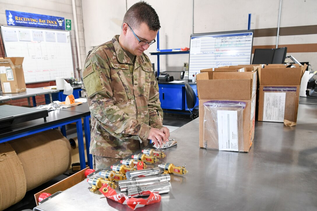 Senior Airman Alec Couture, munitions inspector with the 649th Munitions Squadron, inspects NASA assets on recently acquired electrostatic discharge workstations. The squadron recently purchased the workstations with Air Force Material Command squadron innovation funds, which has improved efficiency and safety of incoming and outgoing munitions inspections.
