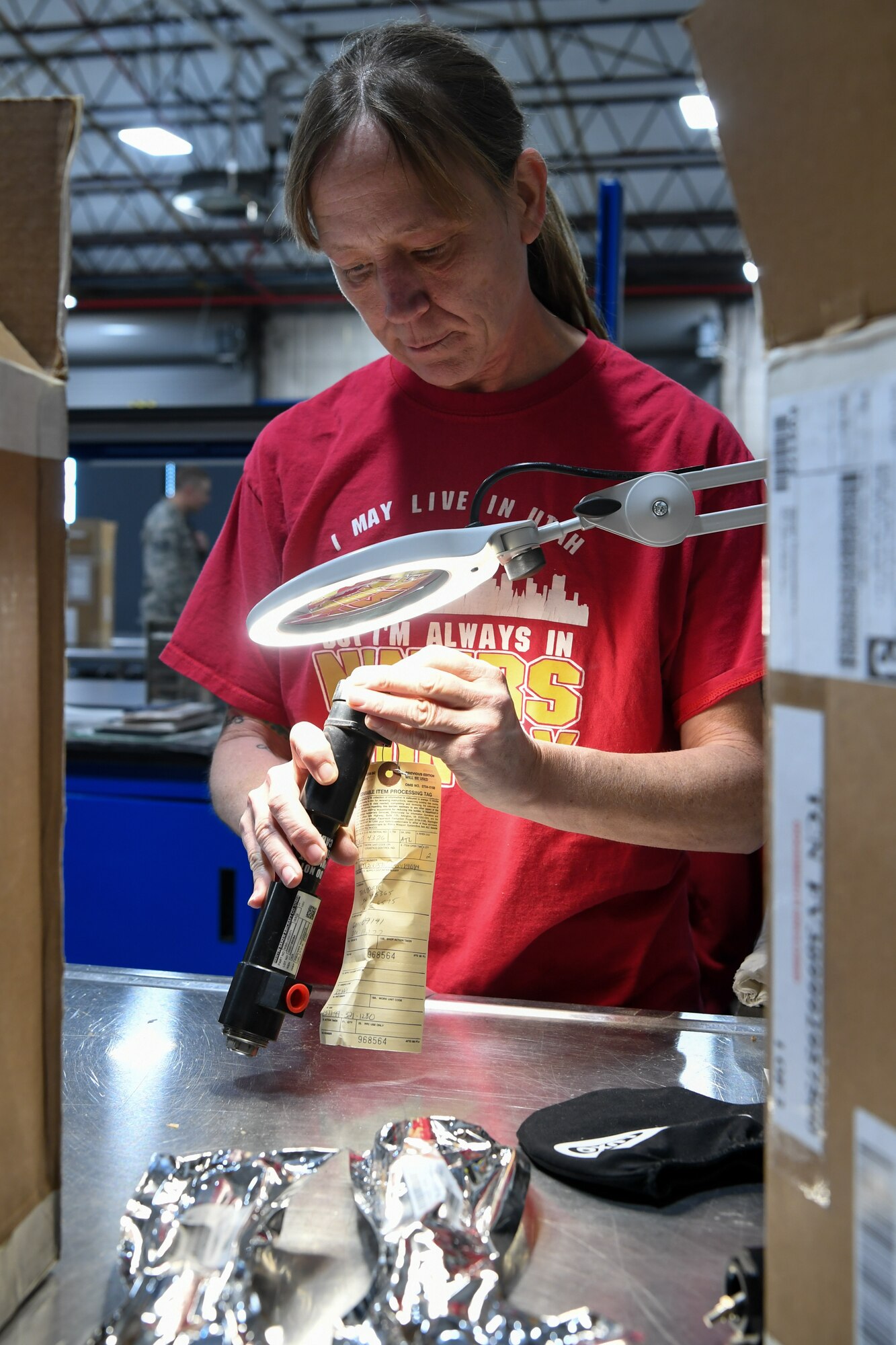 Diana Lawson, munitions inspector with 649th Munitions Squadron, verifies part numbers on a asset with a newly acquired lighted magnifier. The squadron recently purchased new electrostatic discharge workstations with Air Force Material Command squadron innovation funds, which has helped the squadron inspect incoming and outgoing munitions faster and safer.