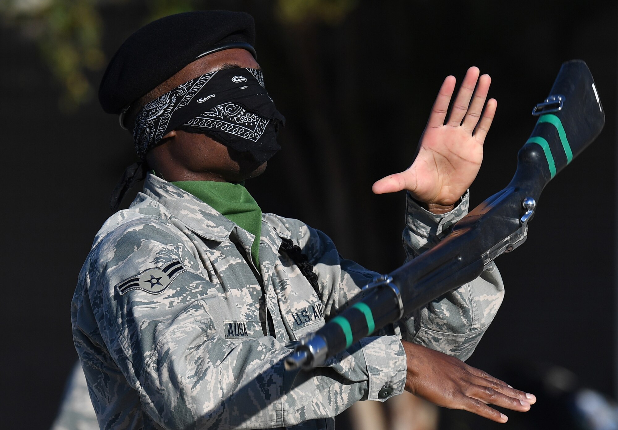 U.S. Air Force Airman 1st Class Abdulahi Alausa, 334th Training Squadron freestyle drill team member, performs during the 81st Training Group drill down on the Levitow Training Support Facility drill pad at Keesler Air Force Base, Mississippi, Nov. 1, 2019. Airmen from the 81st TRG competed in a quarterly open ranks inspection, regulation drill routine and freestyle drill routine. Keesler trains more than 30,000 students each year. While in training, Airmen are given the opportunity to volunteer to learn and execute drill down routines. (U.S. Air Force photo by Kemberly Groue)