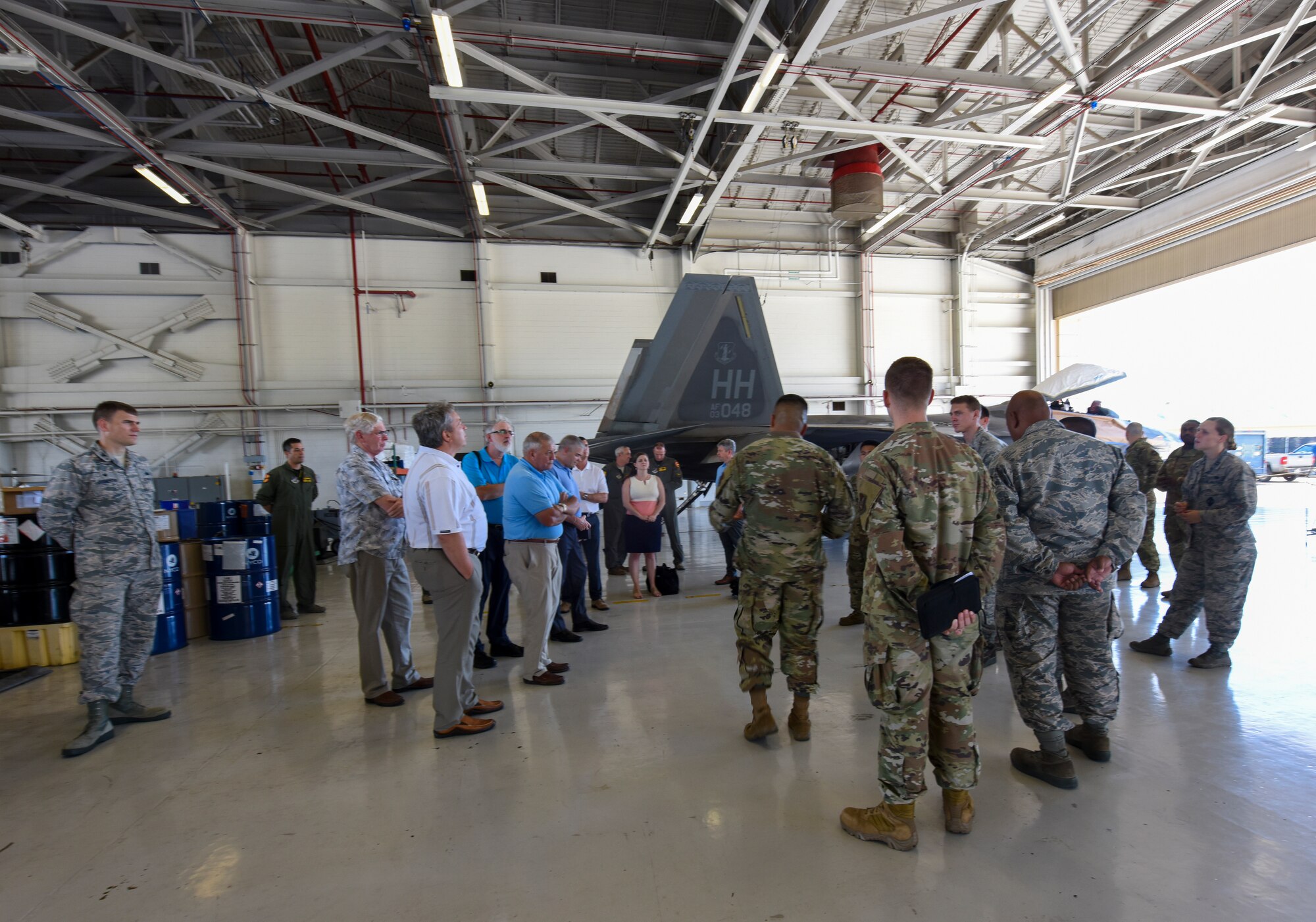 Members of the National Commission on Military Aviation Safety (NCMAS) take a tour of the F-22 Raptor facility Nov. 1, 2019, at Joint Base Pearl Harbor-Hickam. The purpose of NCMAS is to examine past mishaps and make recommendations to the President, Congress and ultimately the Defense Department on ways to improve aviation safety and readiness in the military. As part of their review, members of NCMAS conducted site visits of various flight facilities and operations located on Oahu island. (U.S. Air National Guard photo by Tech. Sgt. Alison Bruce-Maldonado)