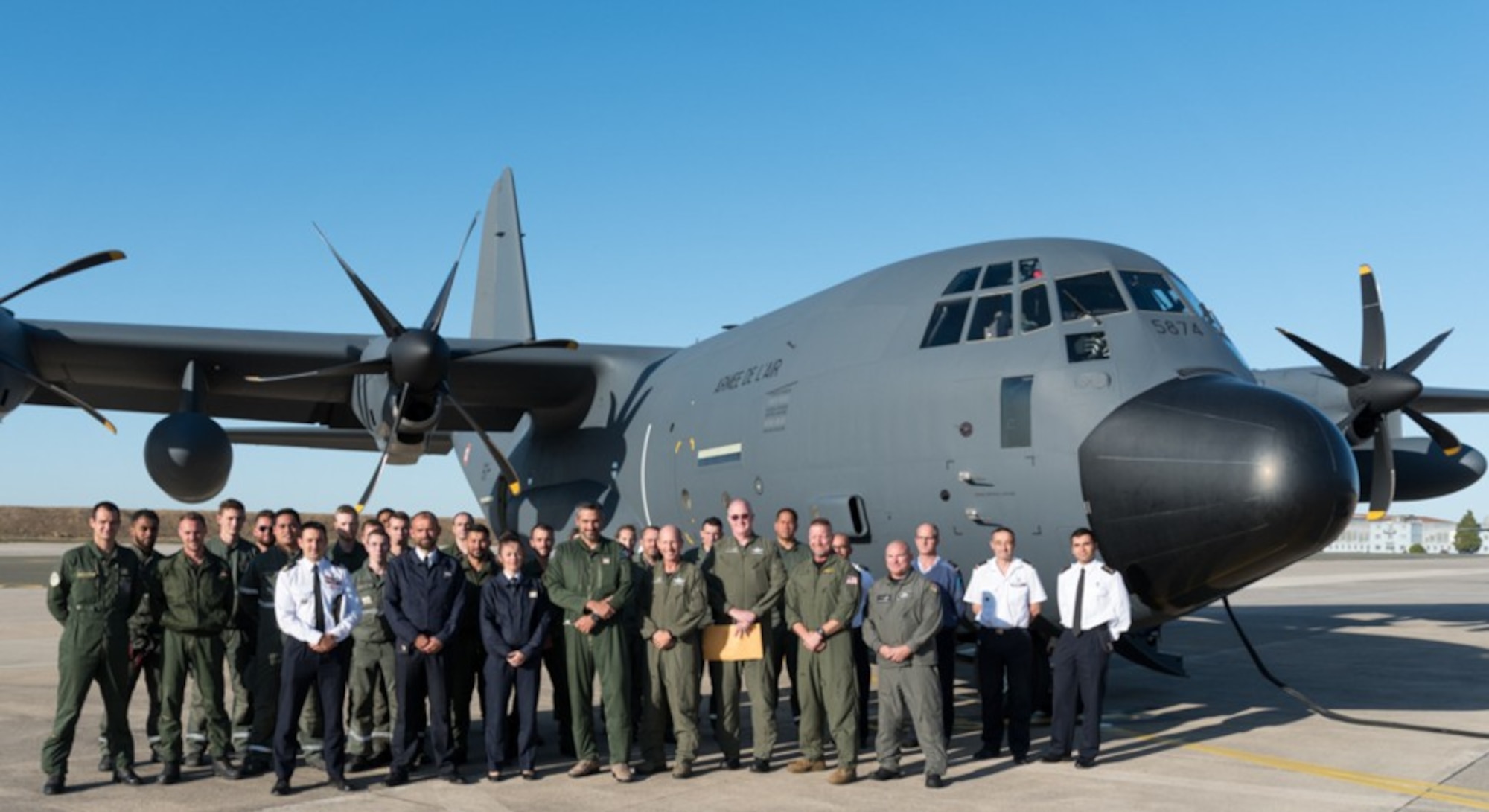 A group of Airmen from the Air Force Air Mobility Command and French Air Force pause for a photo in front of a KC-130J aircraft that was delivered to Évreux-Fauville Air Base, France Sept. 17, 2019. (Courtesy photo)